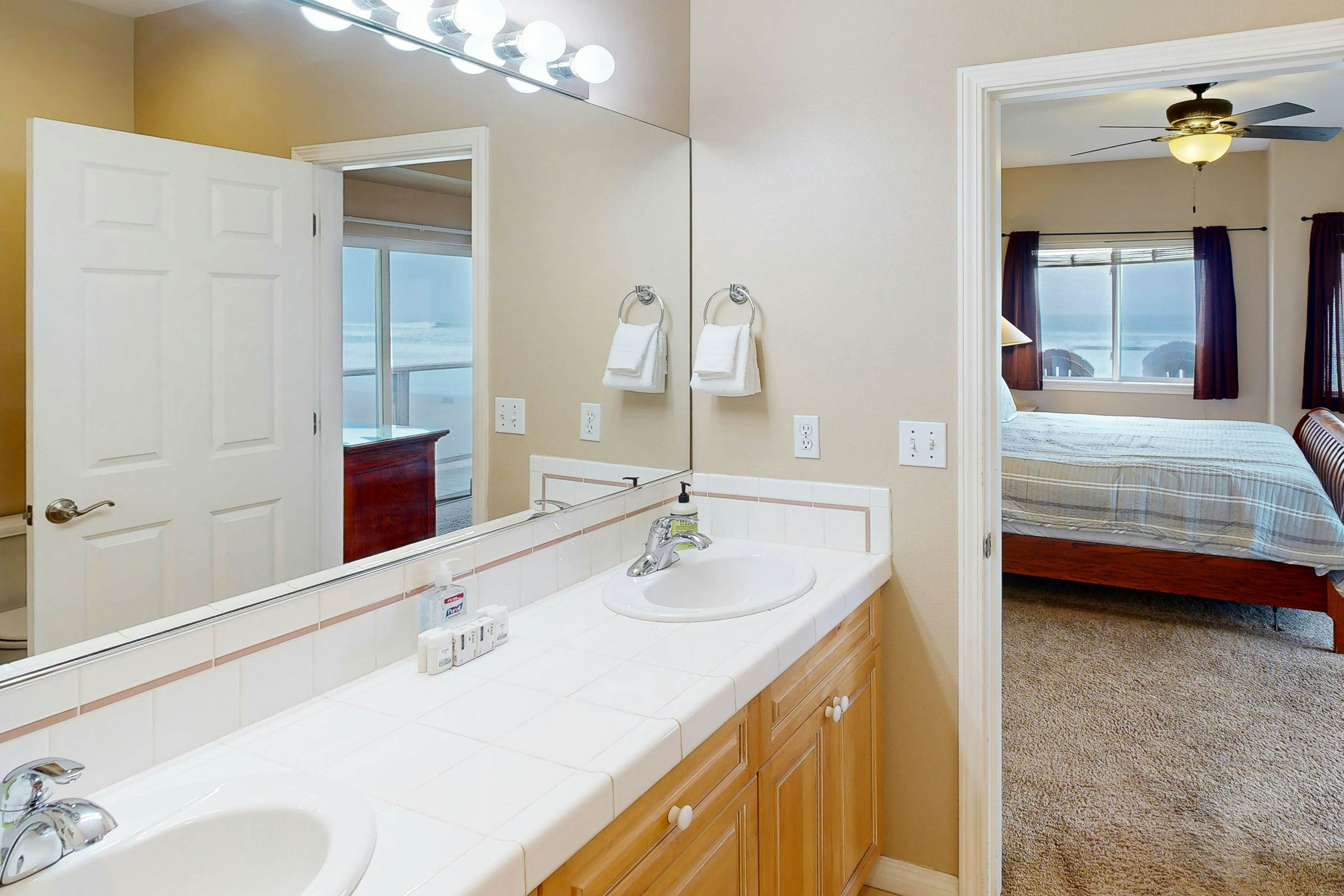 Beautiful home on the ocean with beach views, deck, bbq, WiFi, and streaming