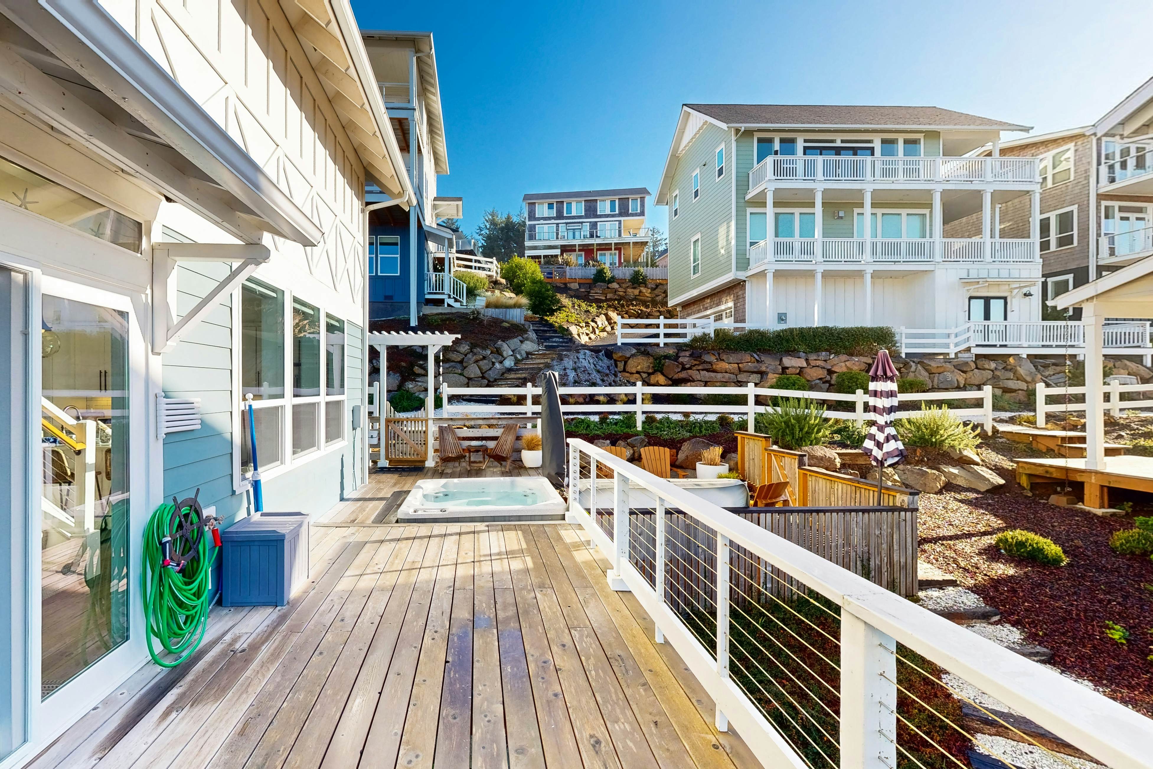 Beautiful family-friendly home with private hot tub, walk to beach, shared pool