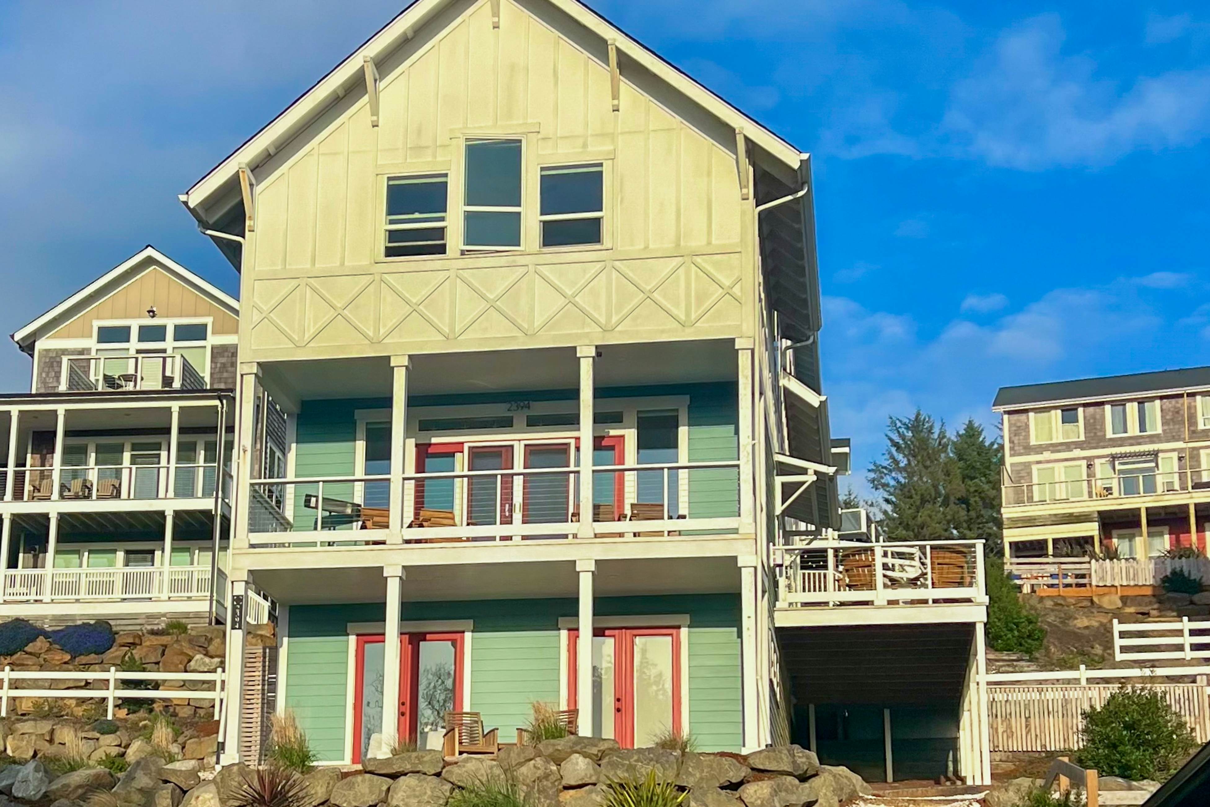 Beautiful family-friendly home with private hot tub, walk to beach, shared pool