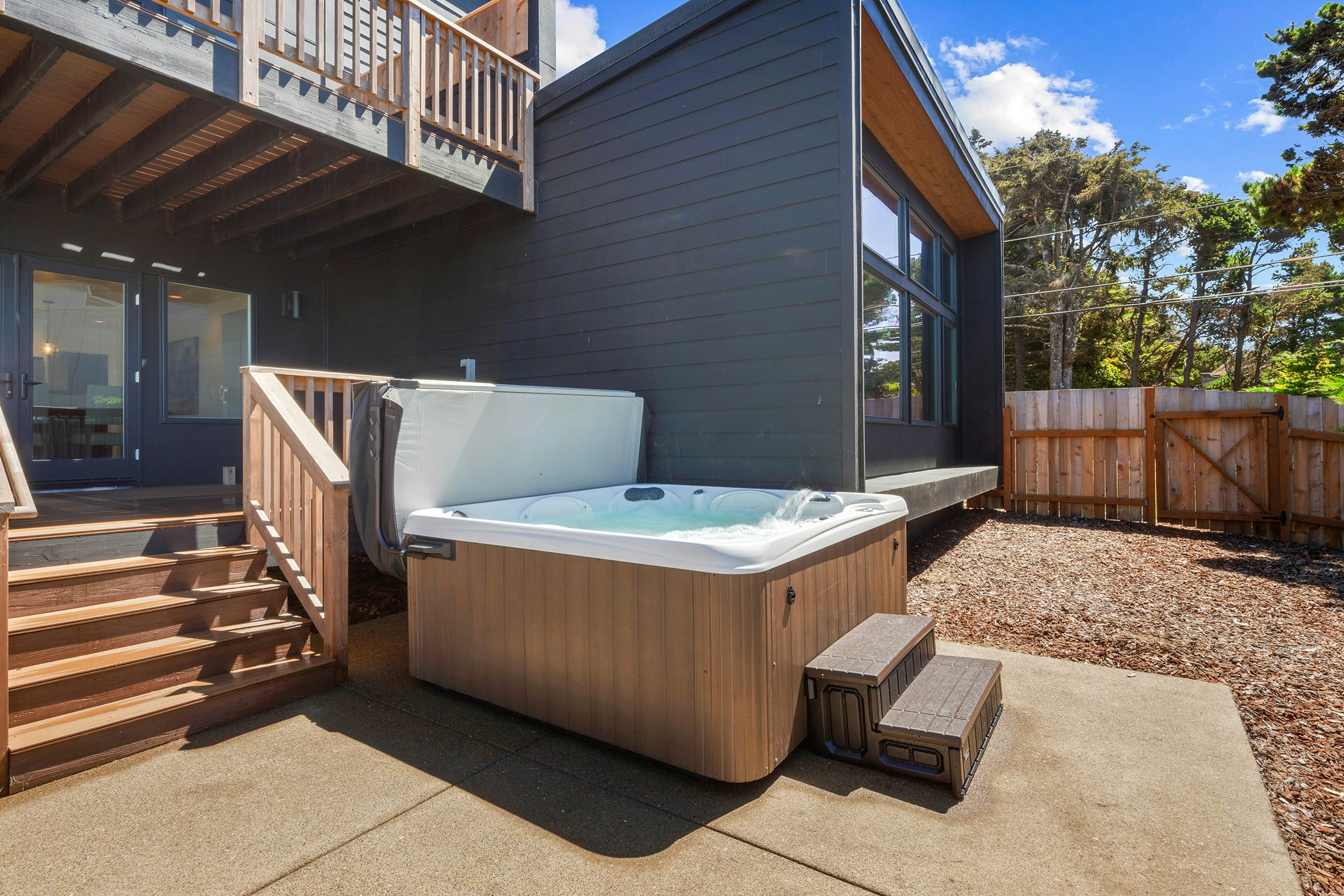 Spacious home with ocean view, enclosed yard, fireplace, hut tub, washer & dryer