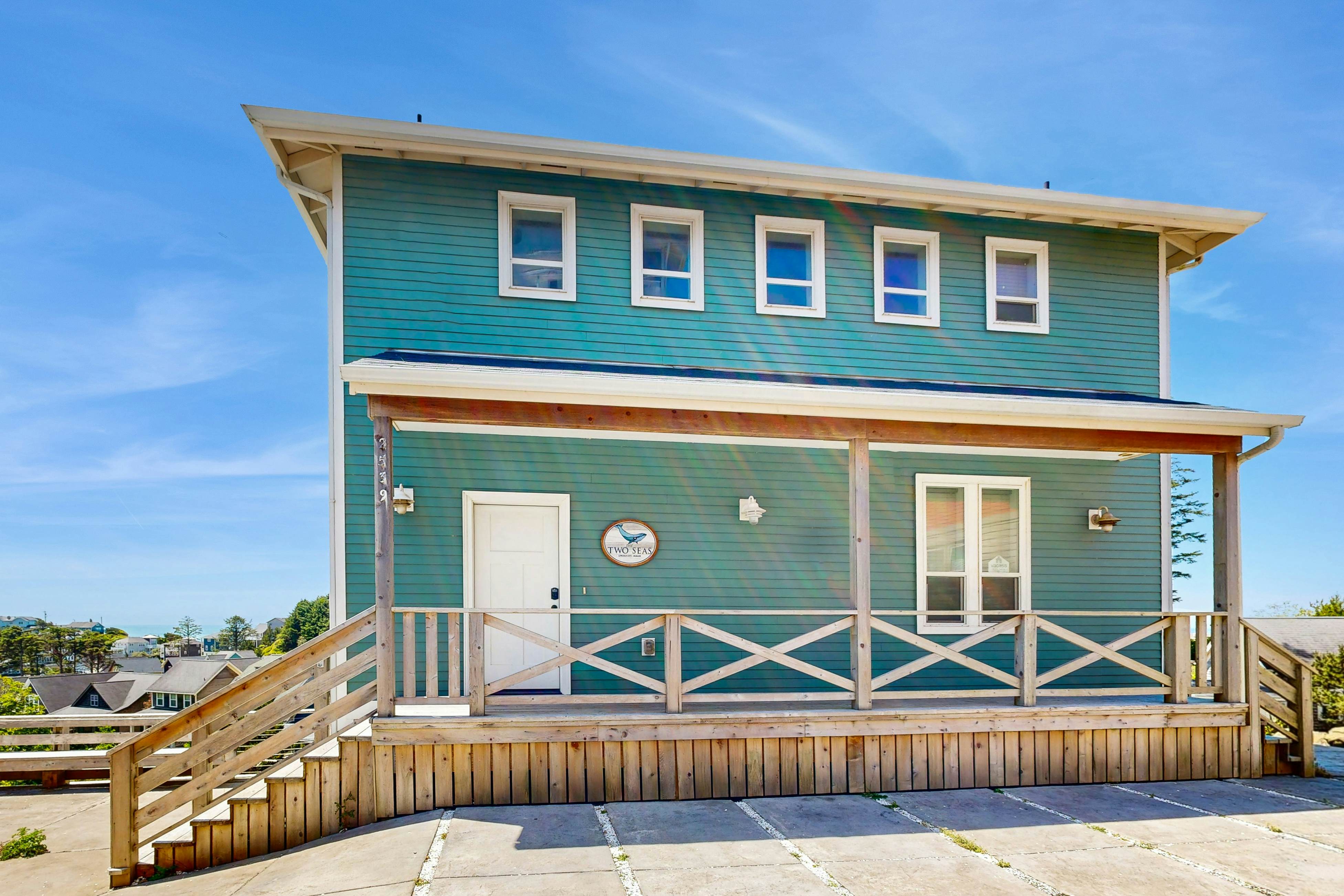 Ocean-view home in Olivia Beach with decks, fireplaces & pool access - dogs ok