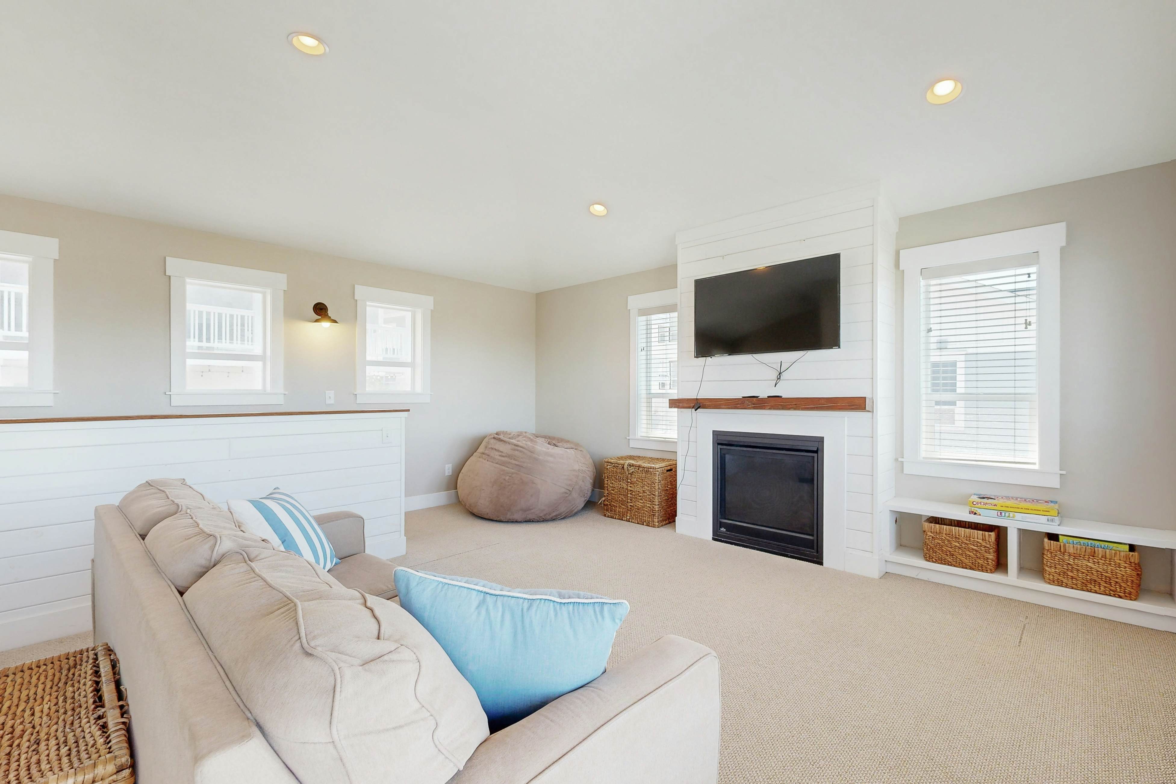 Ocean-view home in Olivia Beach with decks, fireplaces & pool access - dogs ok