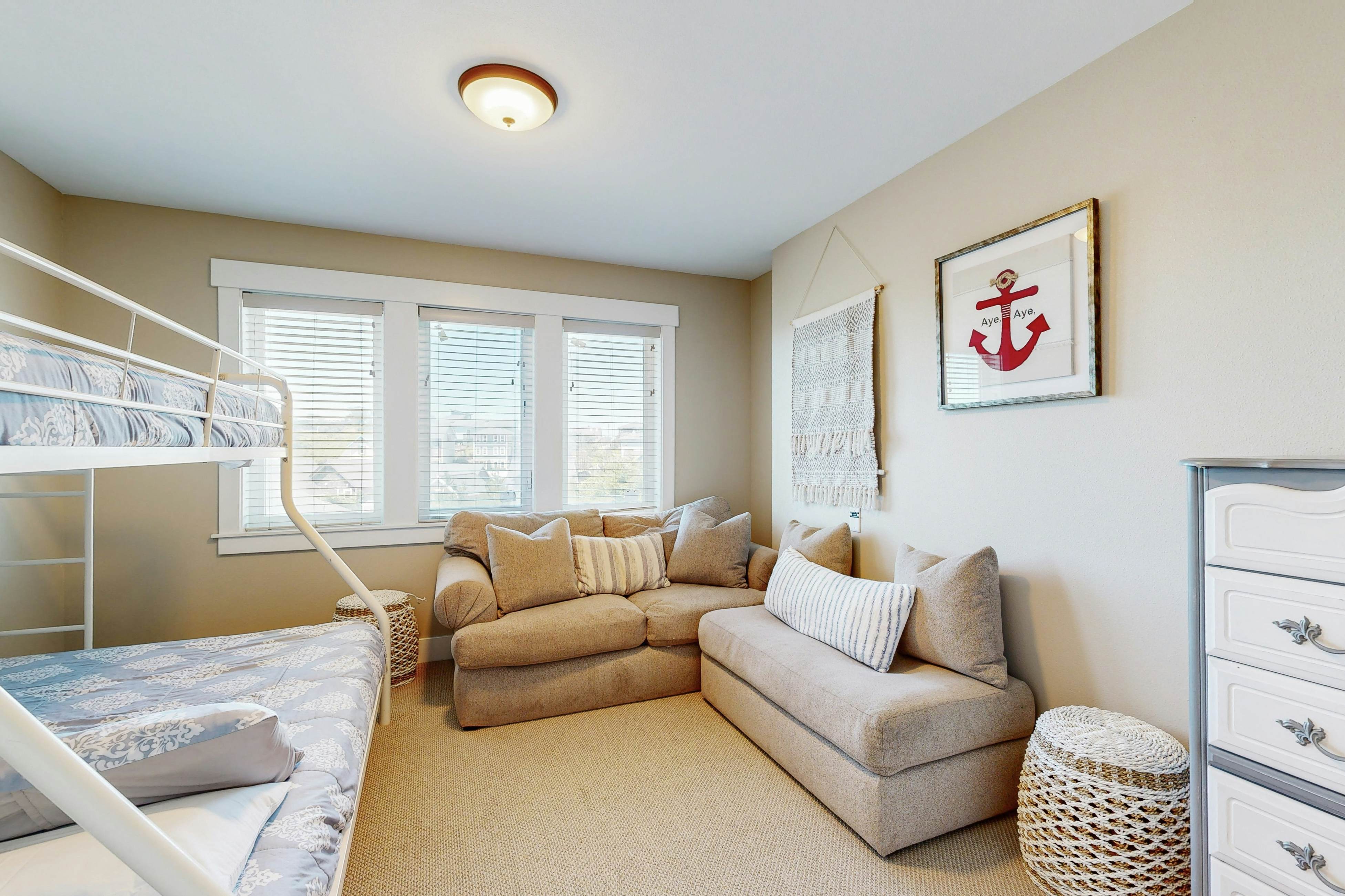 Ocean-view home in Olivia Beach with decks, fireplaces & pool access - dogs ok