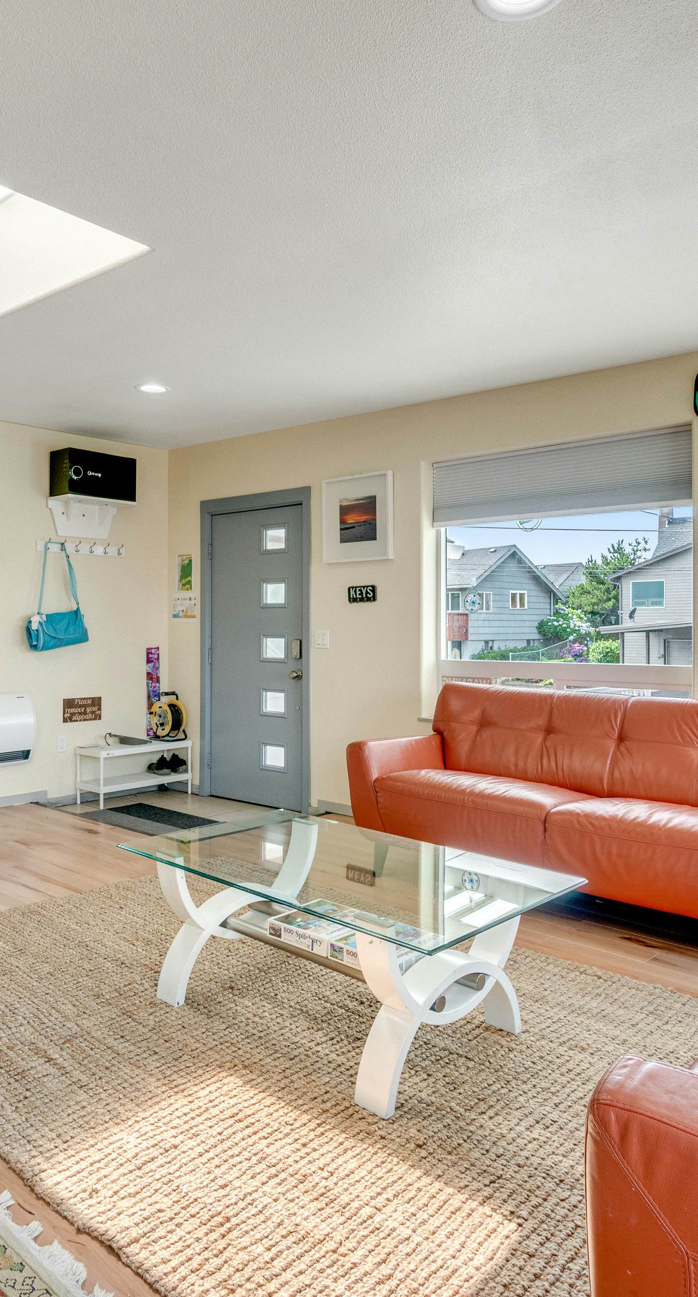 Light filled home in the heart of town with deck and with D steps to beach access