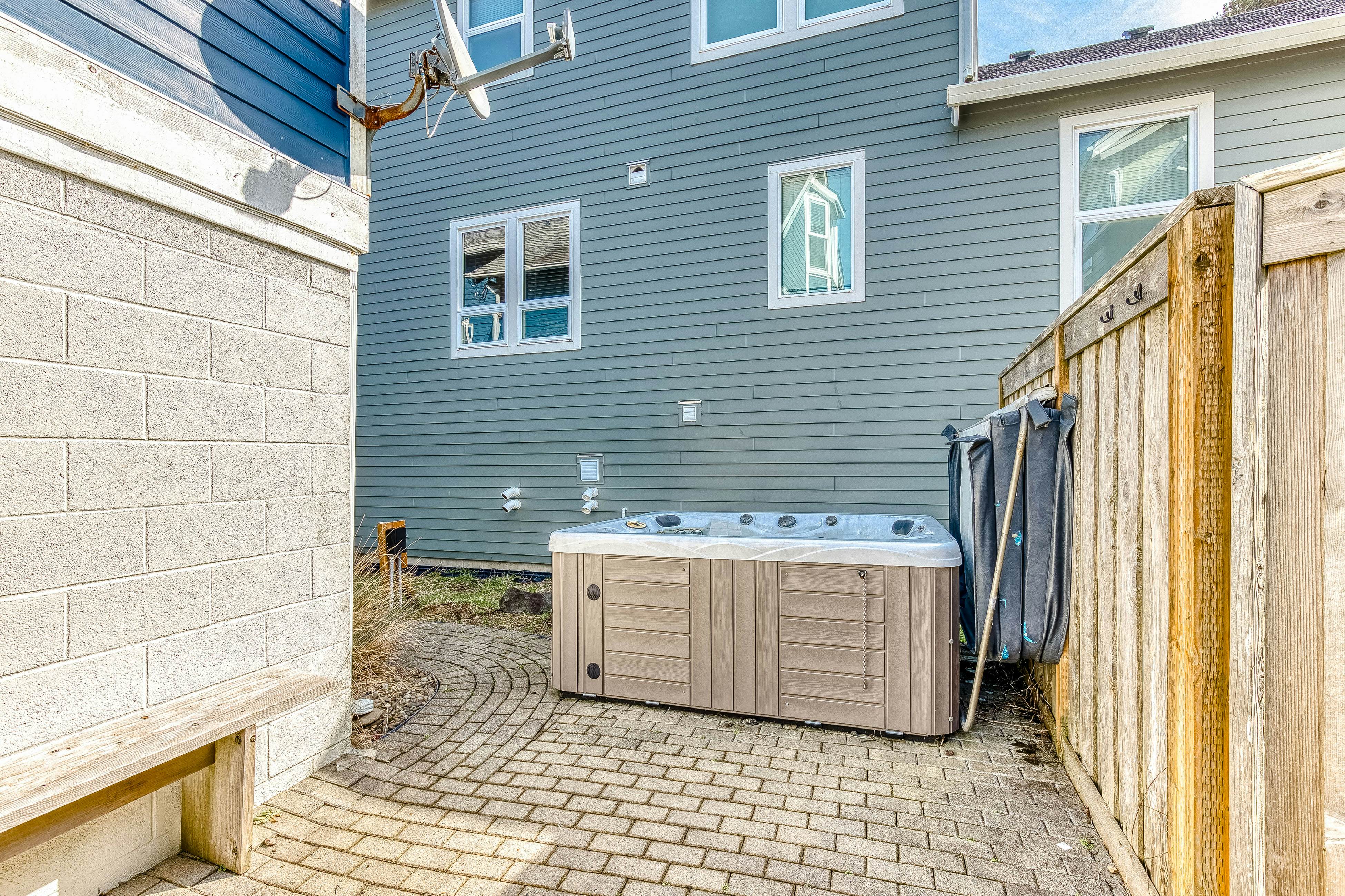 Ocean-view home 1 block from the beach with hot tub, deck, & fireplace