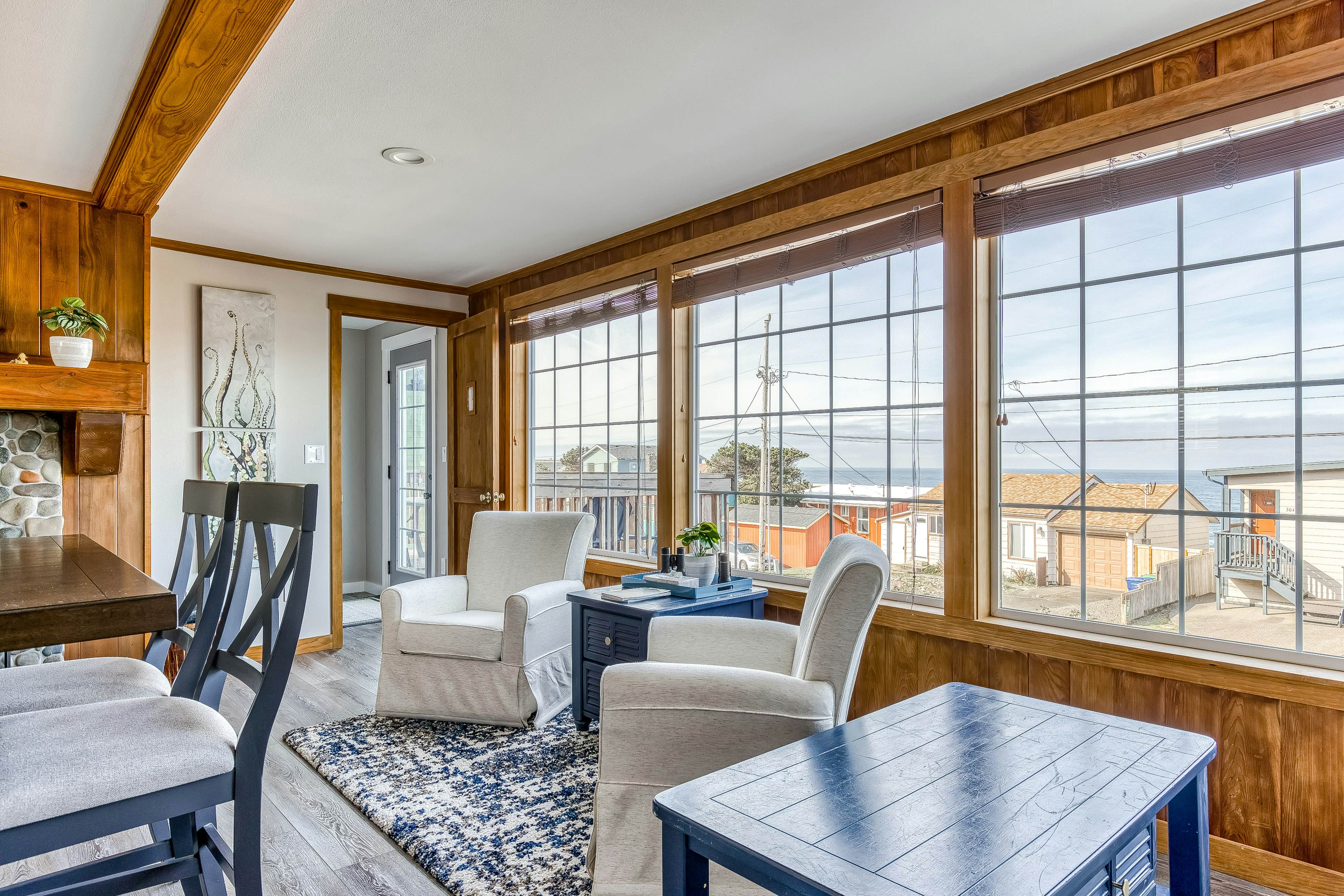 Ocean-view home 1 block from the beach with hot tub, deck, & fireplace