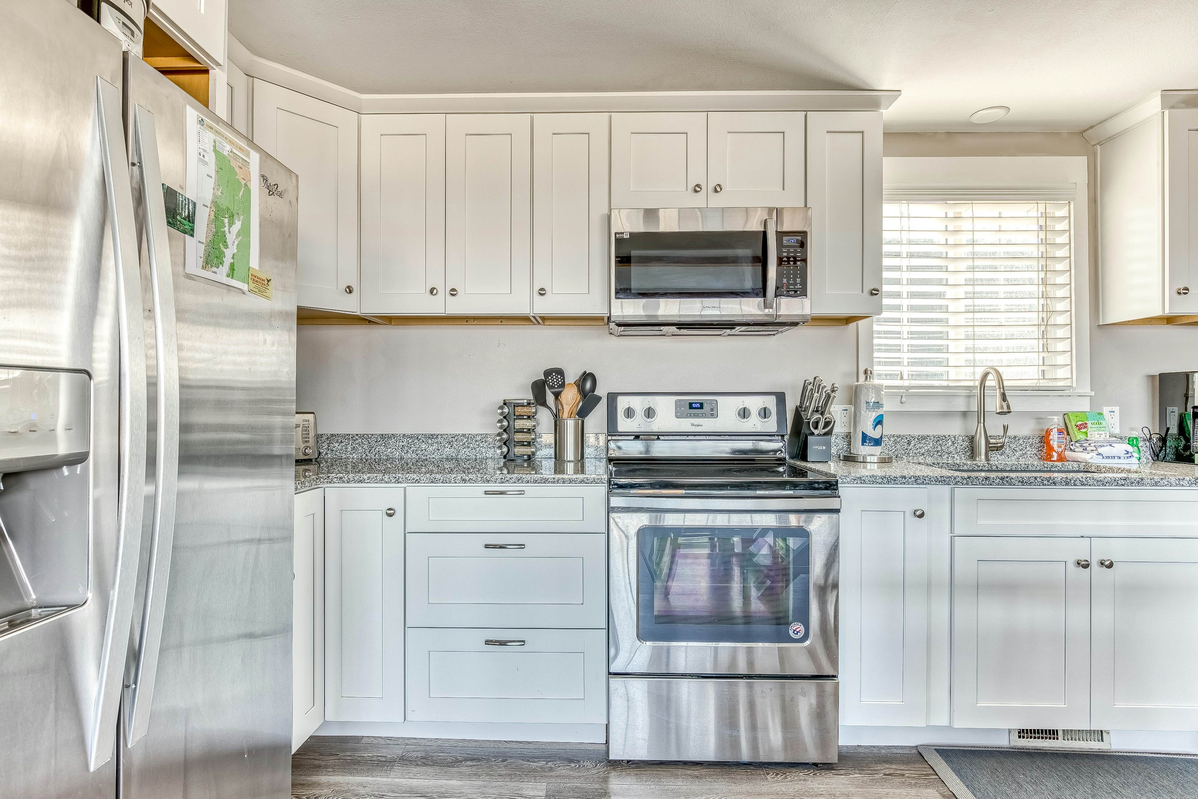 Ocean-view home 1 block from the beach with hot tub, deck, & fireplace