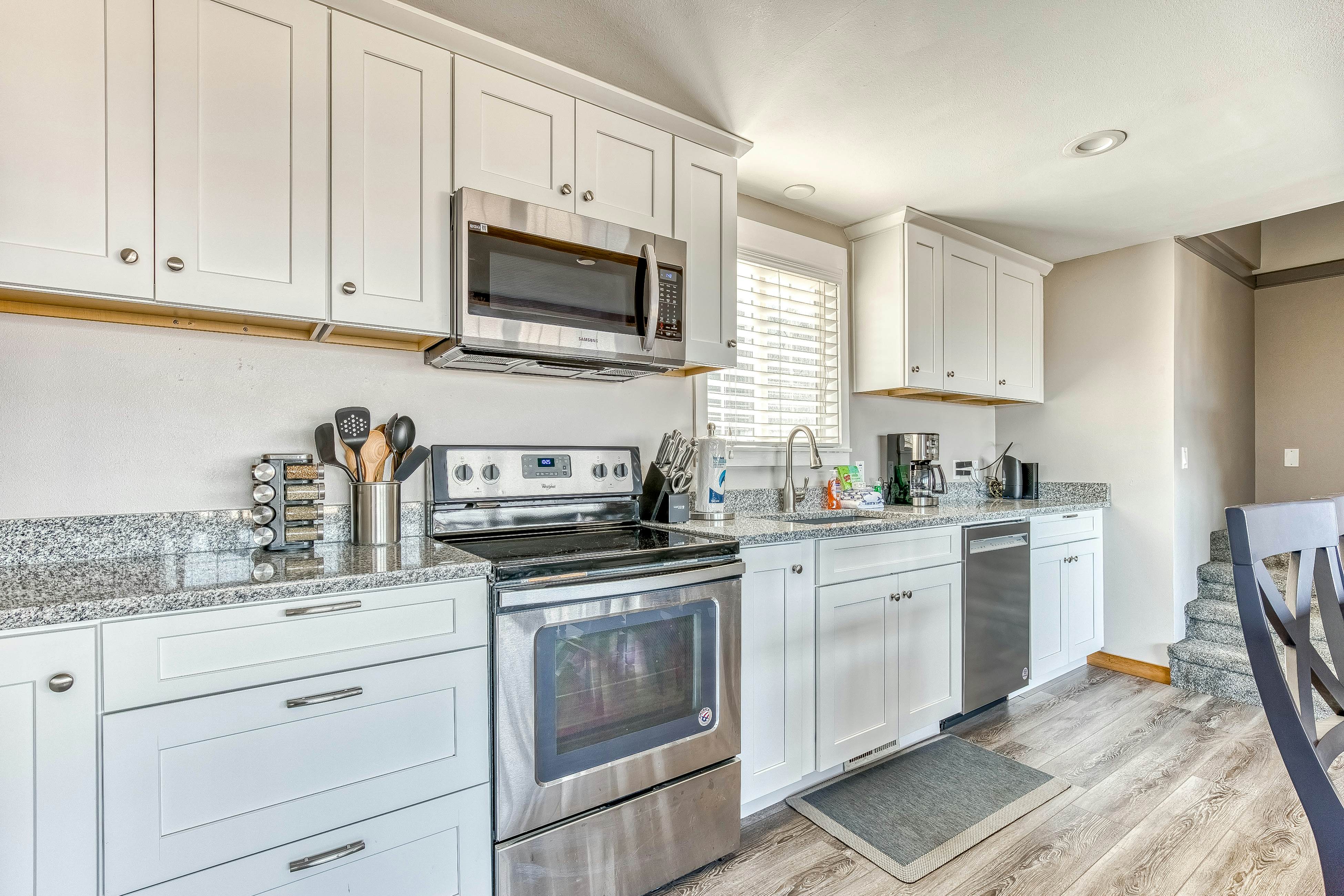 Ocean-view home 1 block from the beach with hot tub, deck, & fireplace