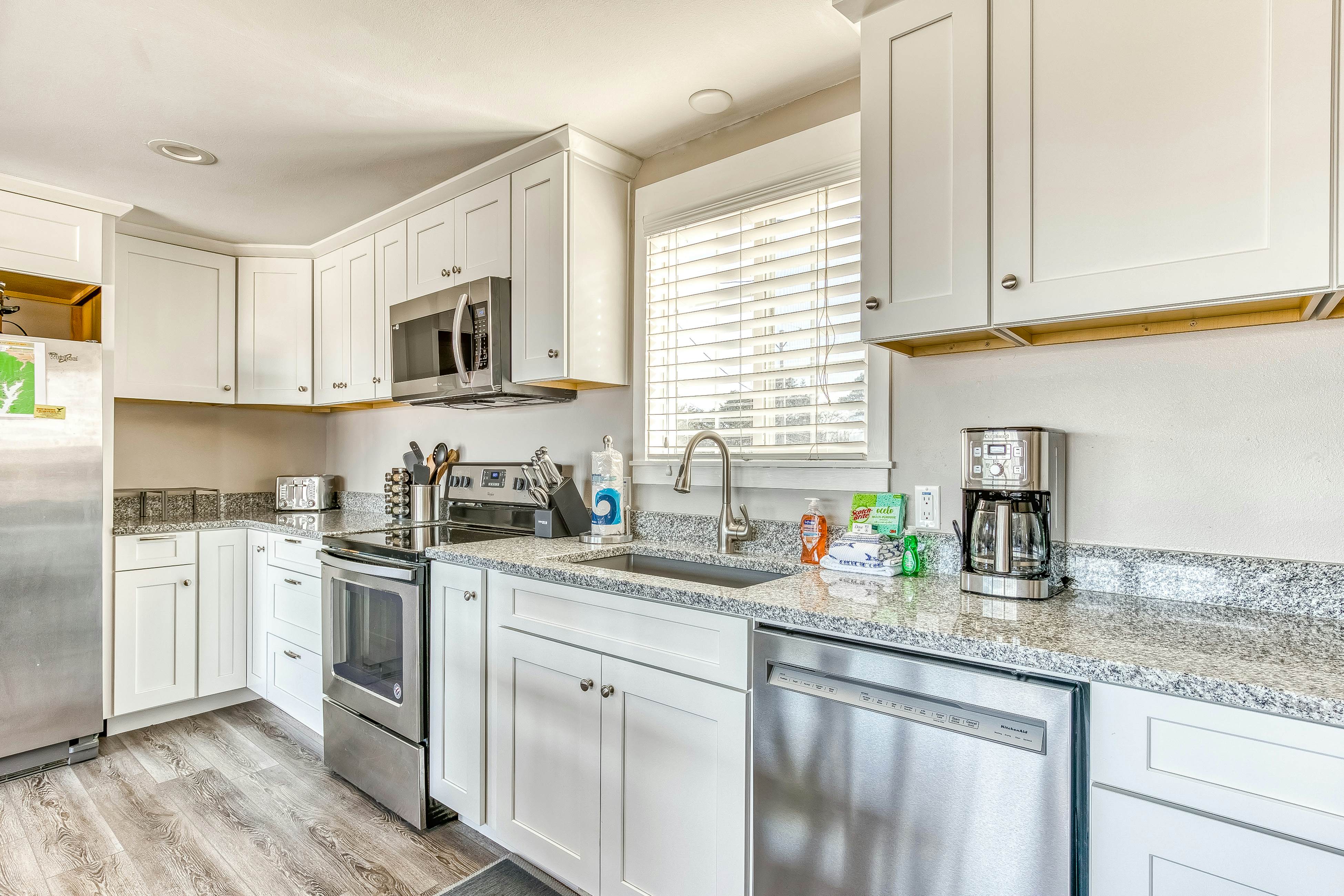 Ocean-view home 1 block from the beach with hot tub, deck, & fireplace