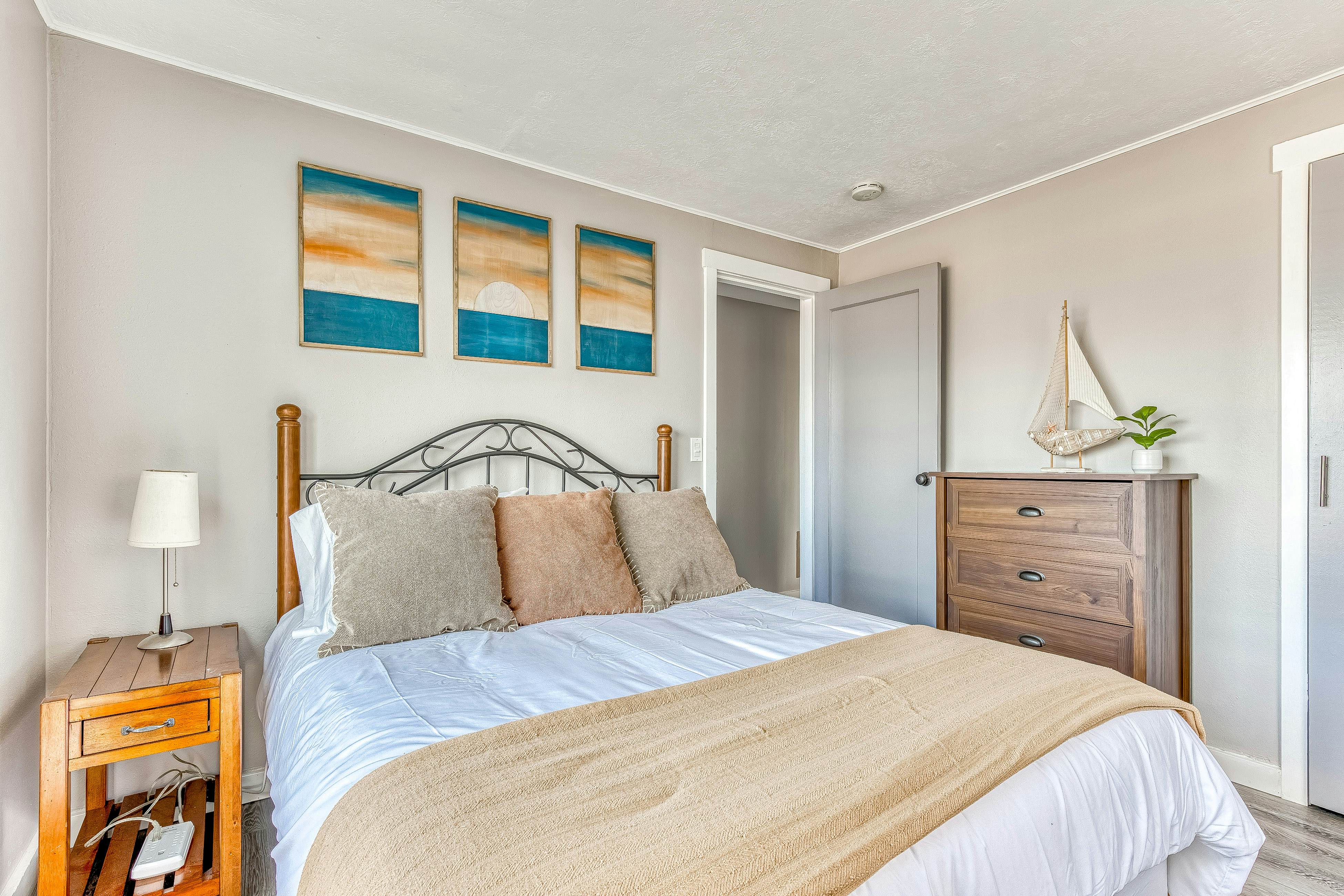 Ocean-view home 1 block from the beach with hot tub, deck, & fireplace