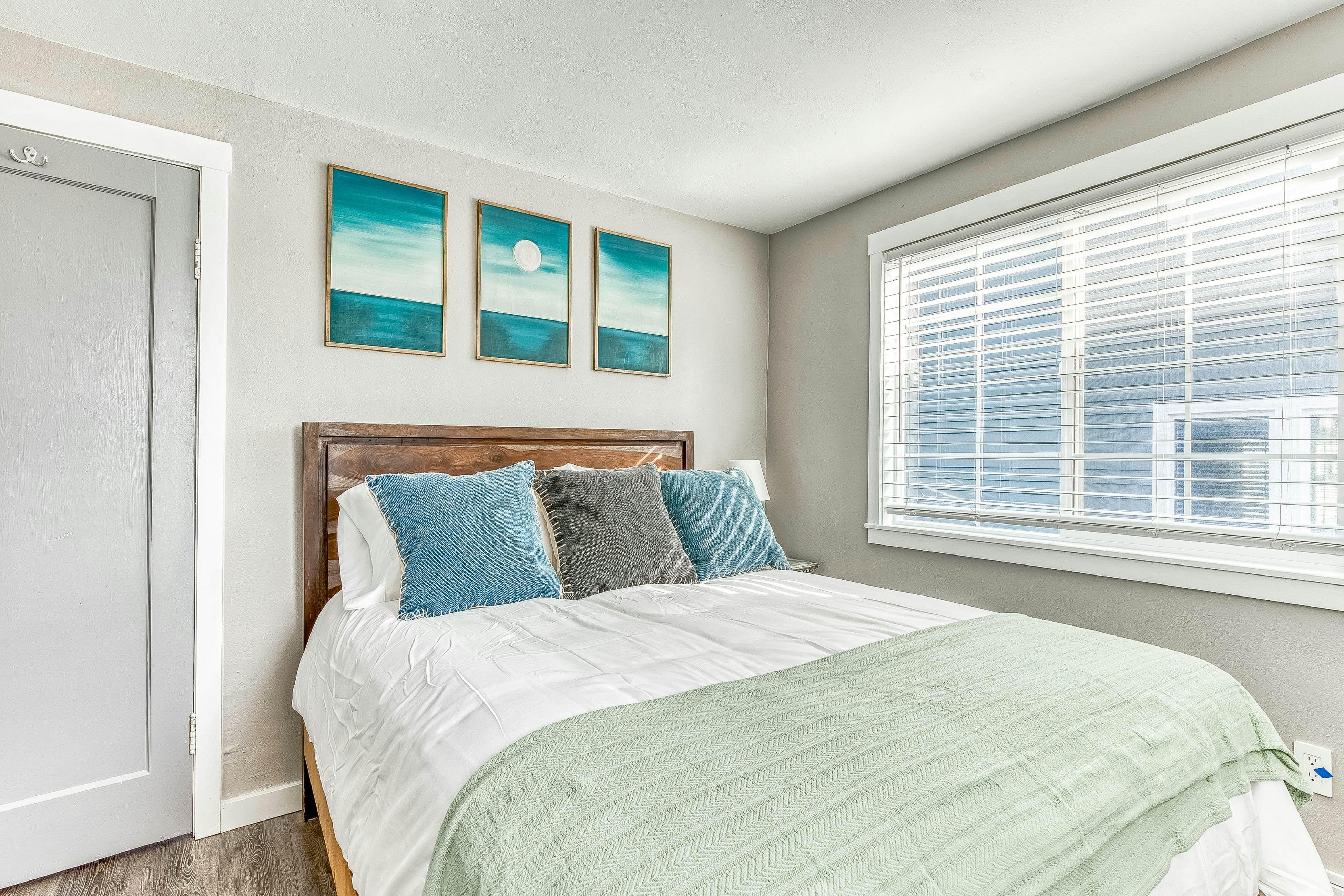 Ocean-view home 1 block from the beach with hot tub, deck, & fireplace