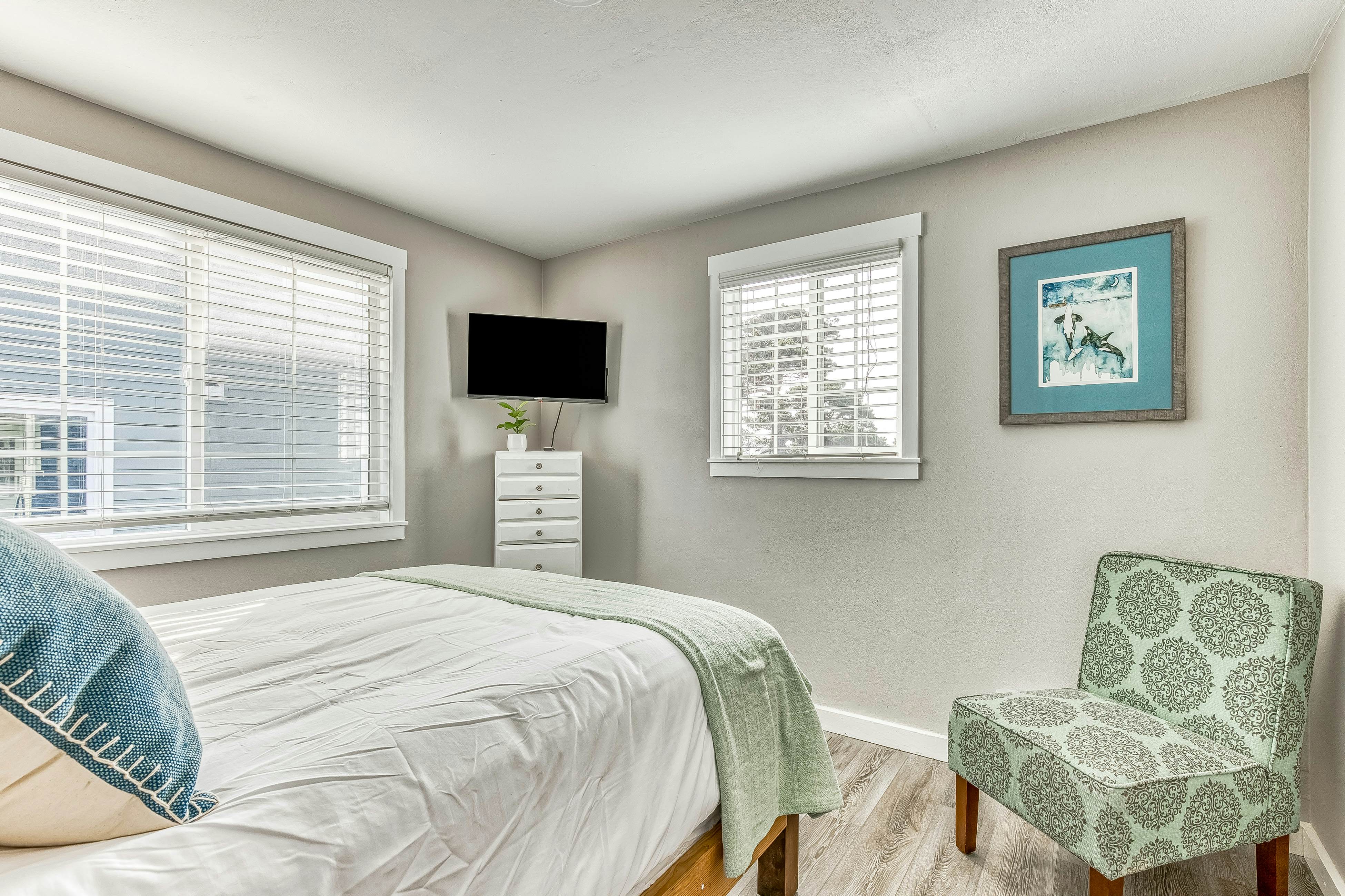 Ocean-view home 1 block from the beach with hot tub, deck, & fireplace