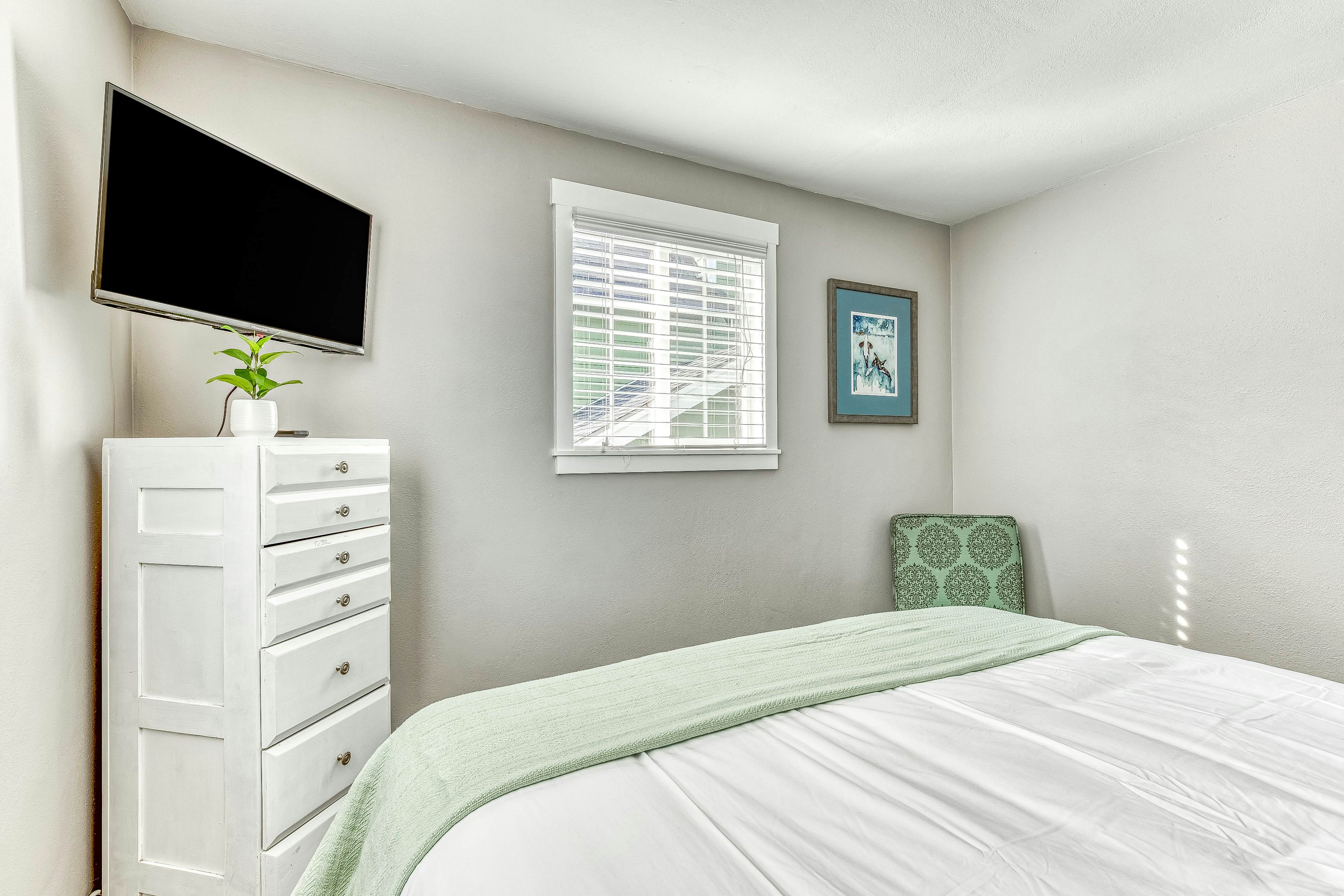 Ocean-view home 1 block from the beach with hot tub, deck, & fireplace