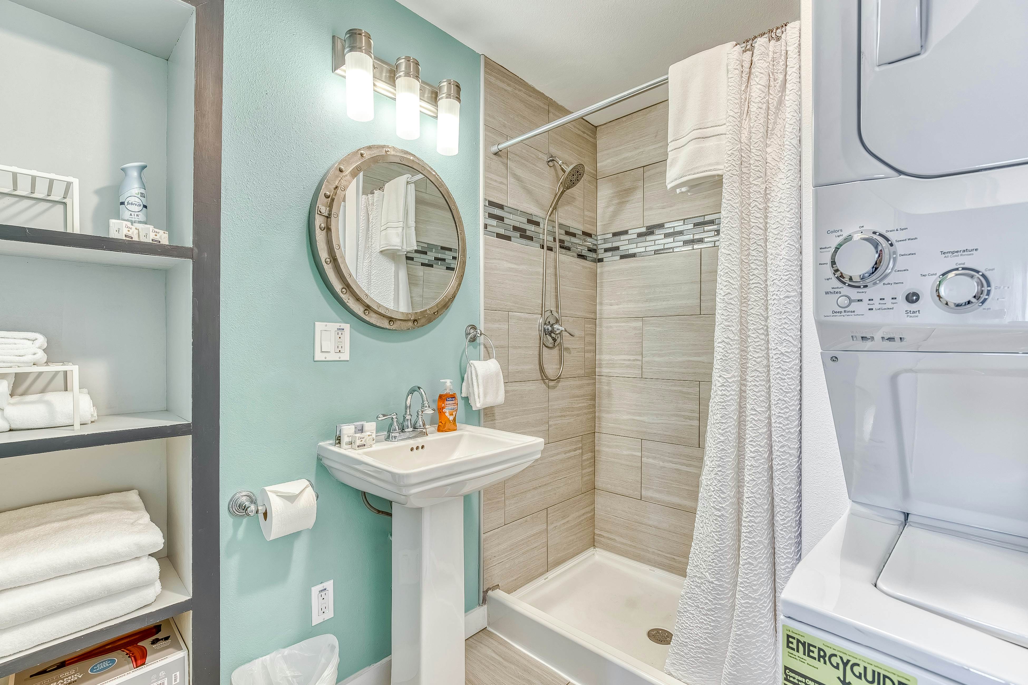 Ocean-view home 1 block from the beach with hot tub, deck, & fireplace