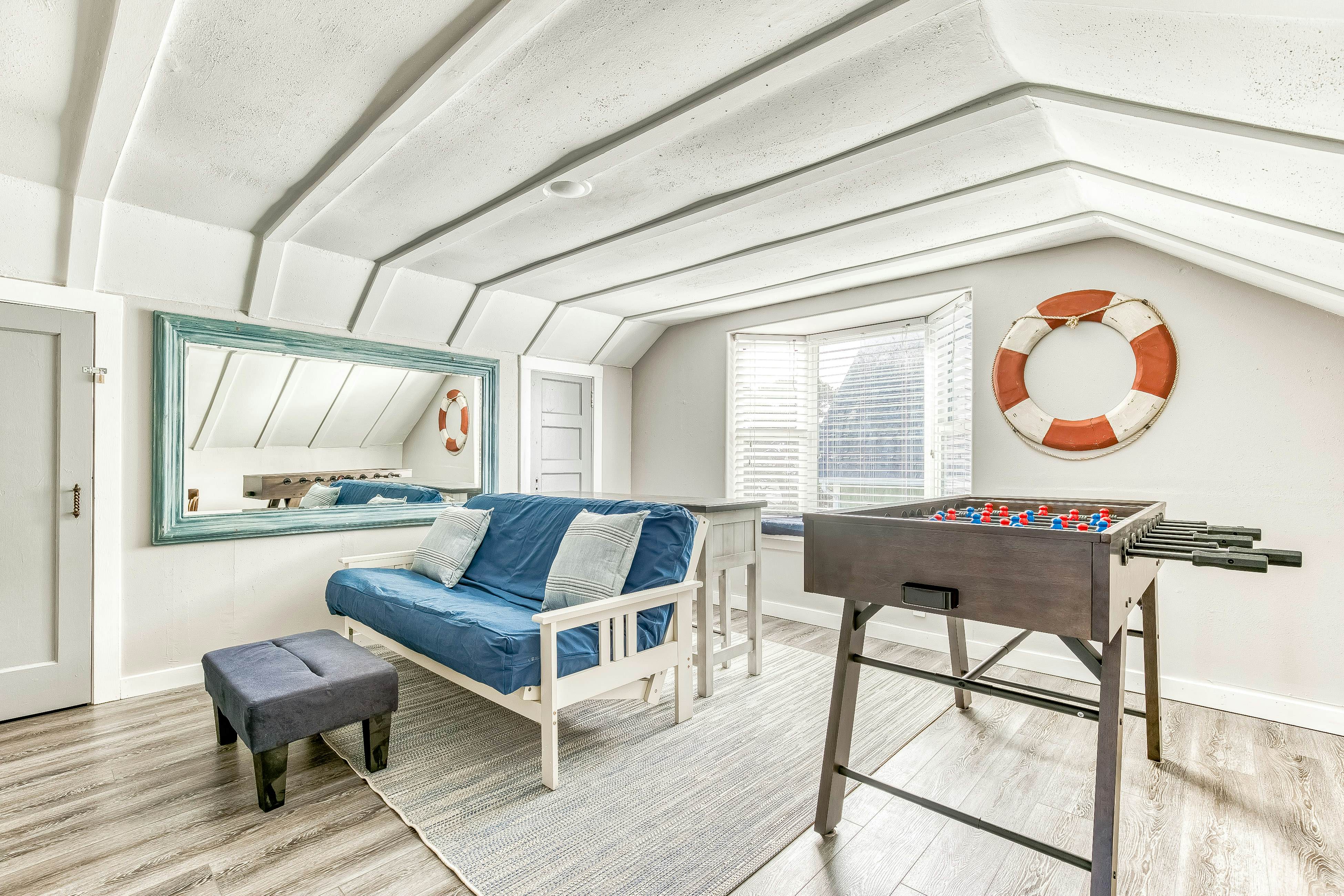 Ocean-view home 1 block from the beach with hot tub, deck, & fireplace