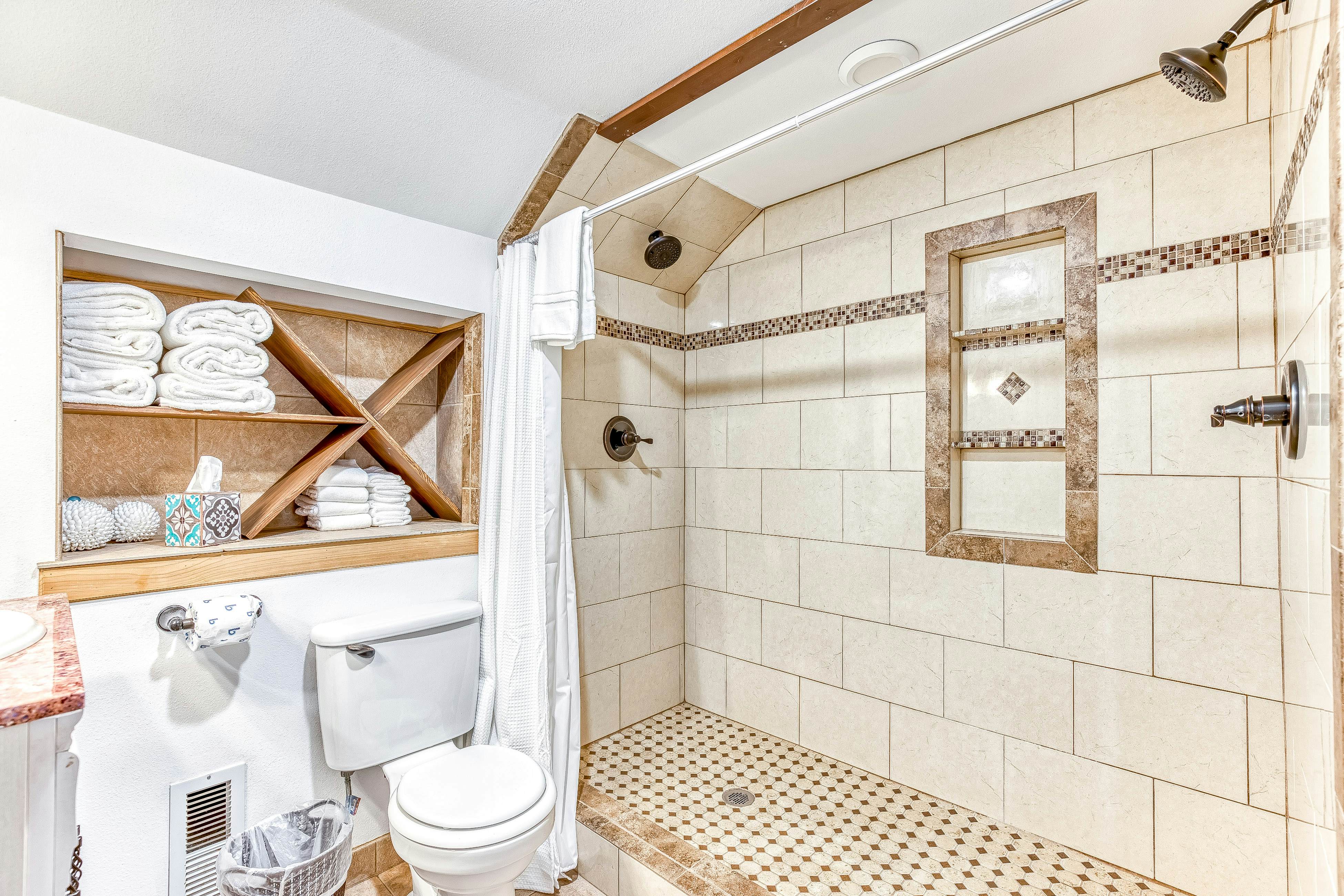 Ocean-view home 1 block from the beach with hot tub, deck, & fireplace