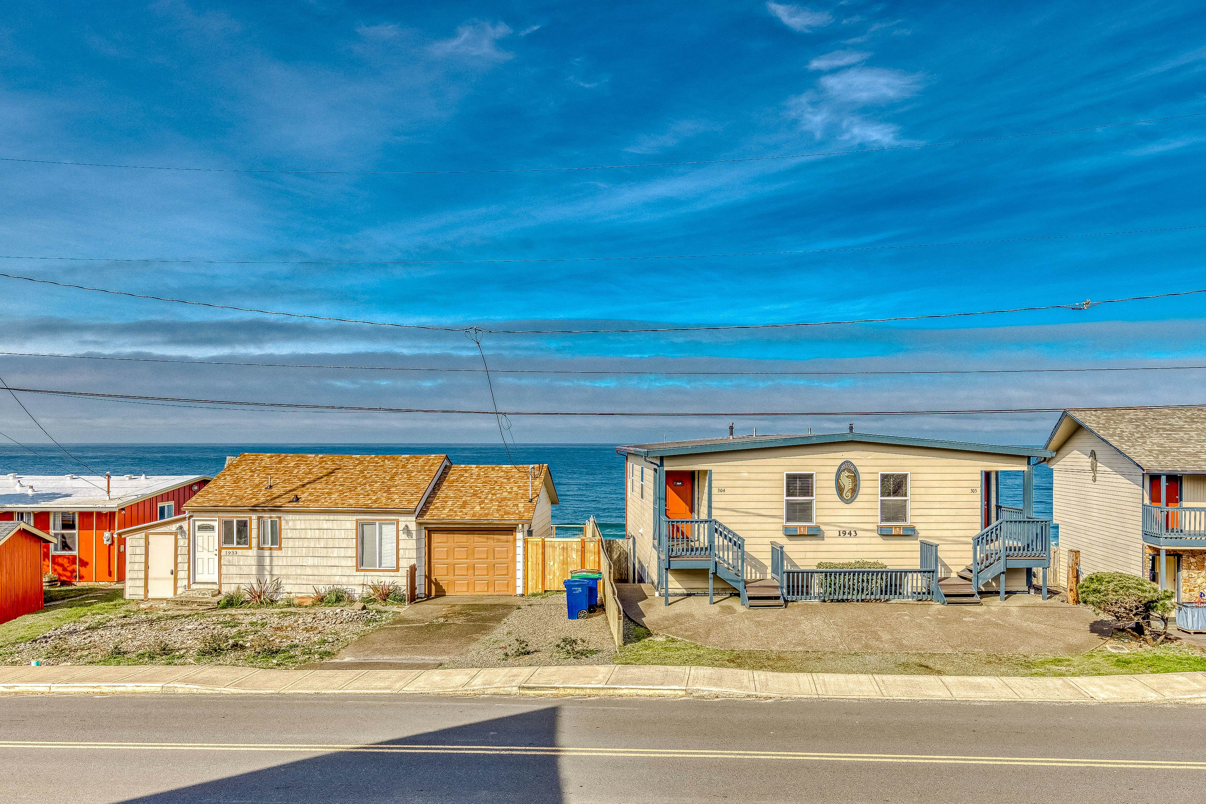 Ocean-view home 1 block from the beach with hot tub, deck, & fireplace