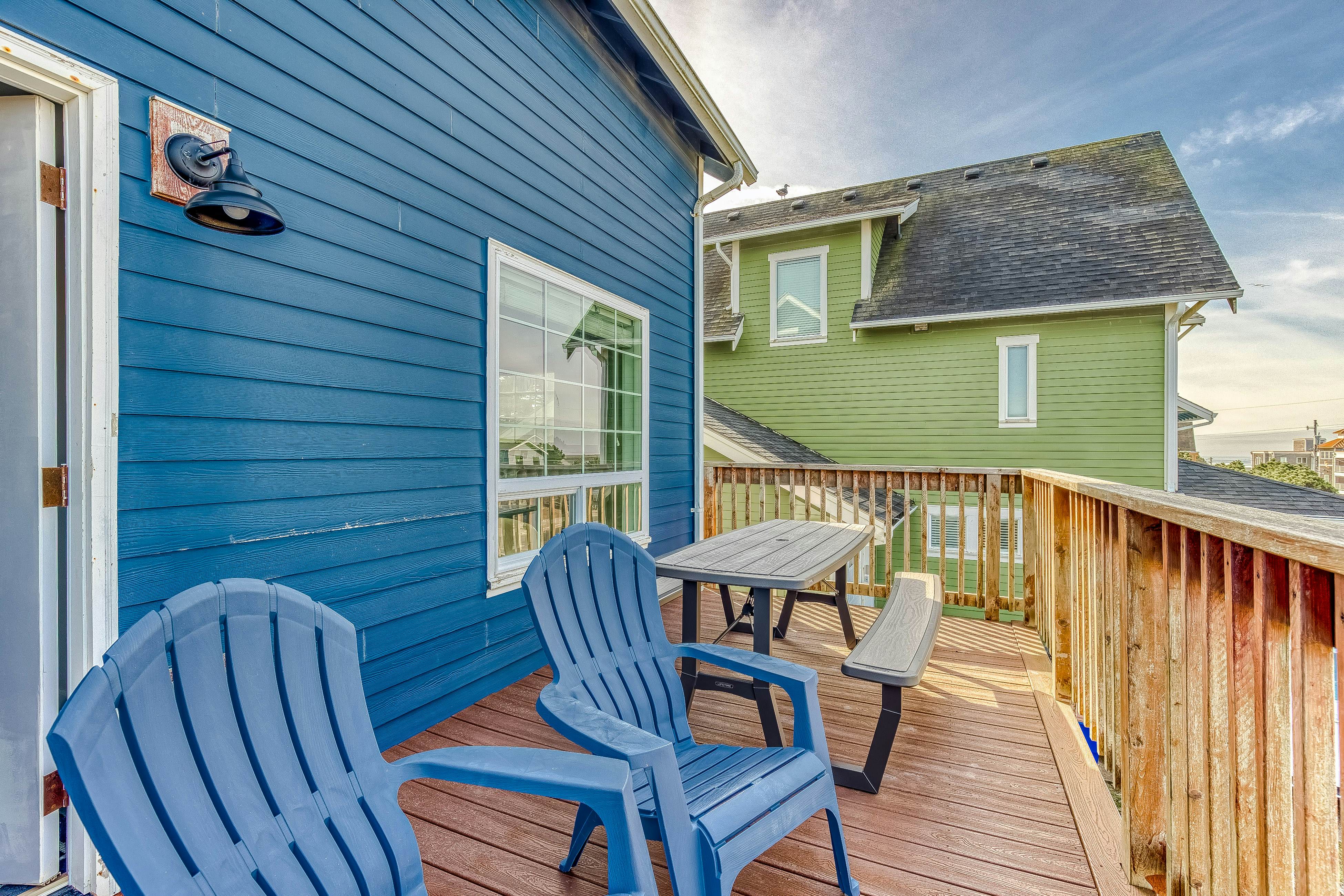 Ocean-view home 1 block from the beach with hot tub, deck, & fireplace