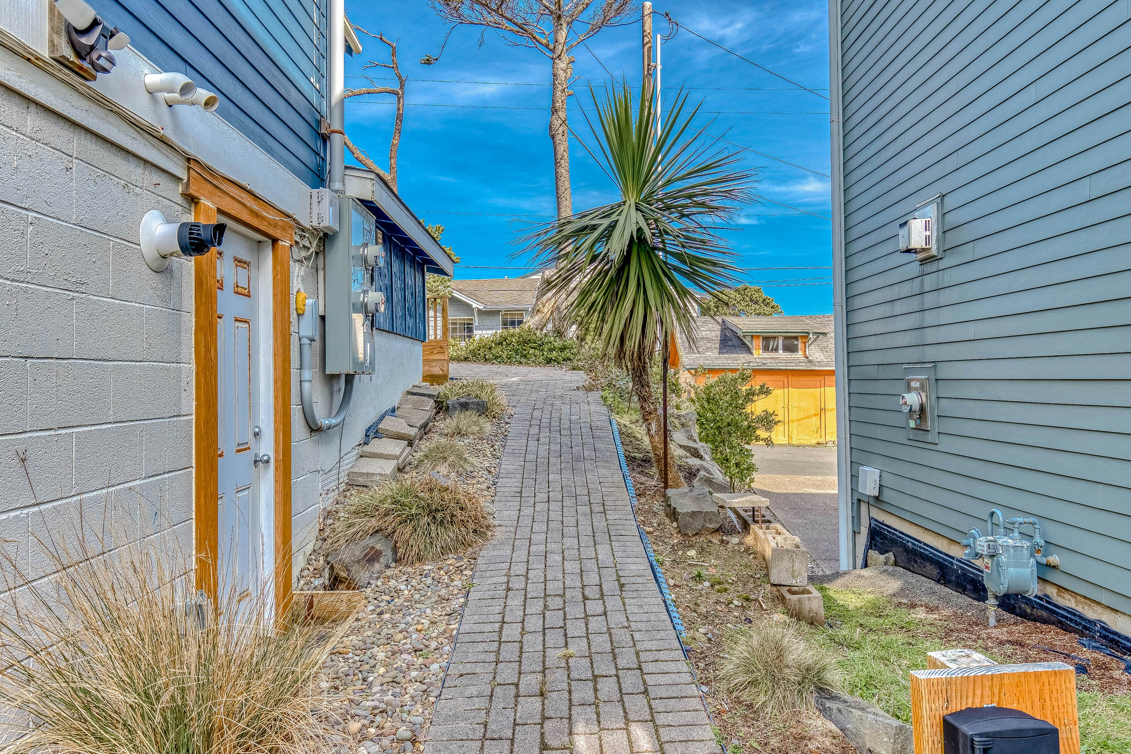 Ocean-view home 1 block from the beach with hot tub, deck, & fireplace