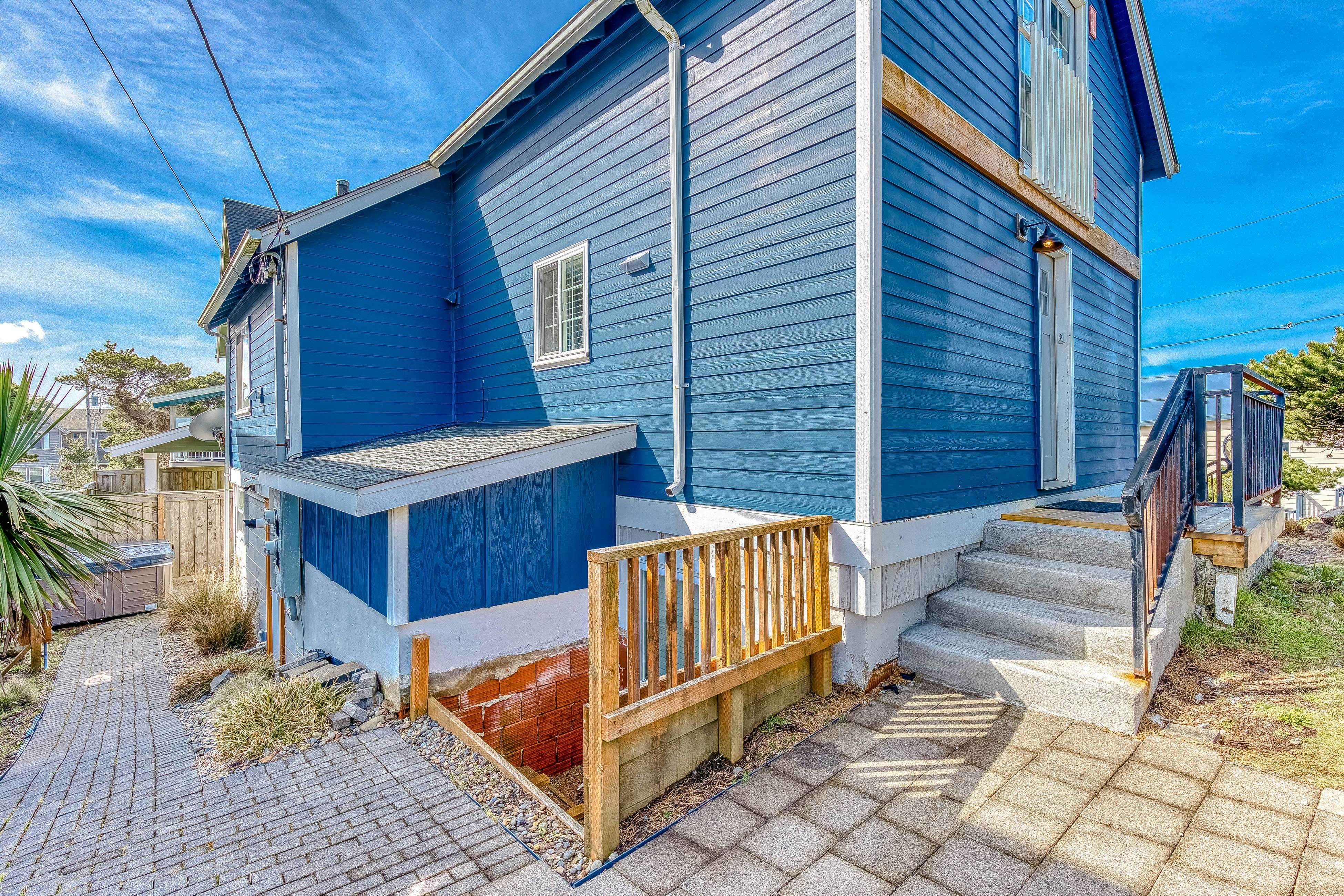 Ocean-view home 1 block from the beach with hot tub, deck, & fireplace