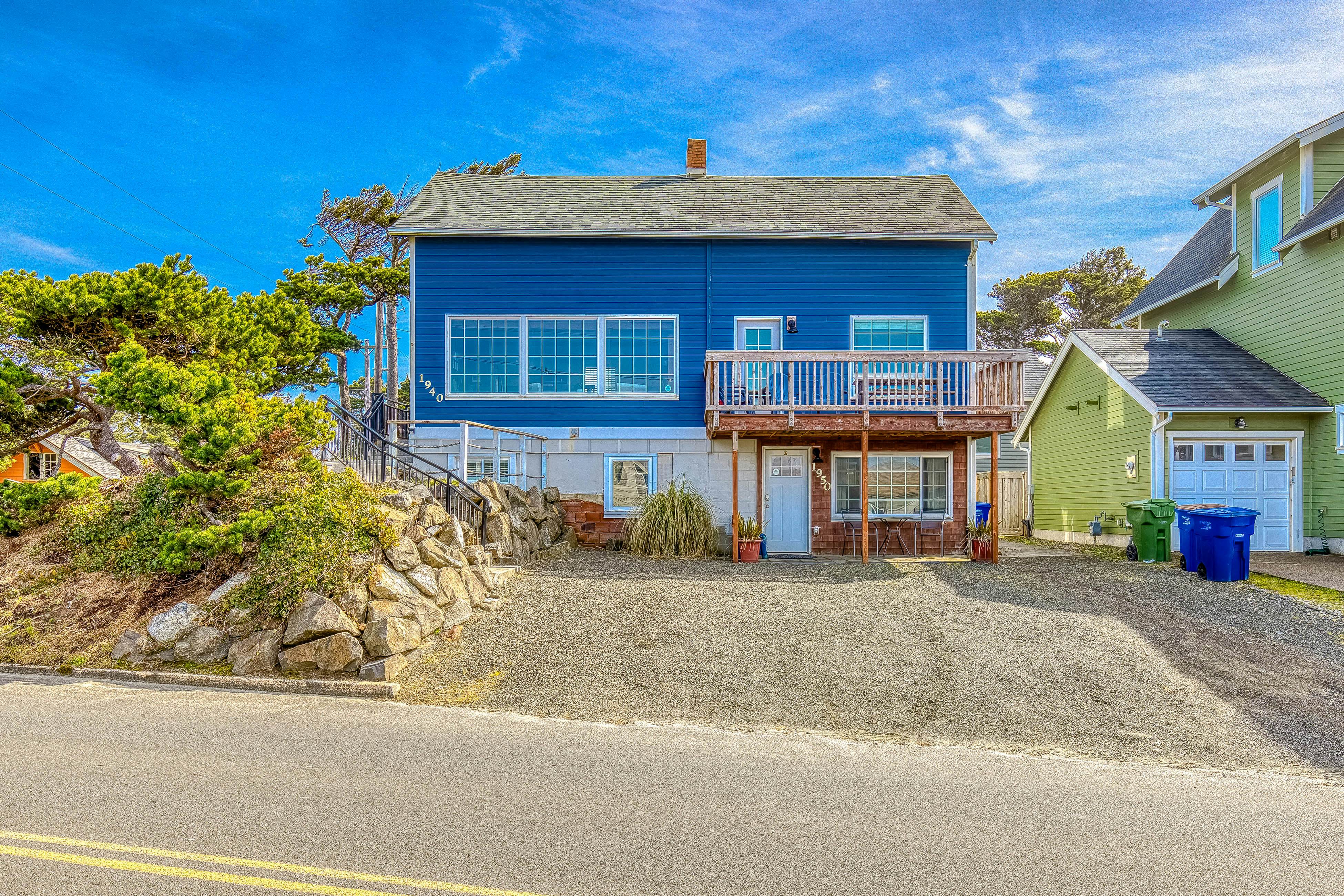 Ocean-view home 1 block from the beach with hot tub, deck, & fireplace