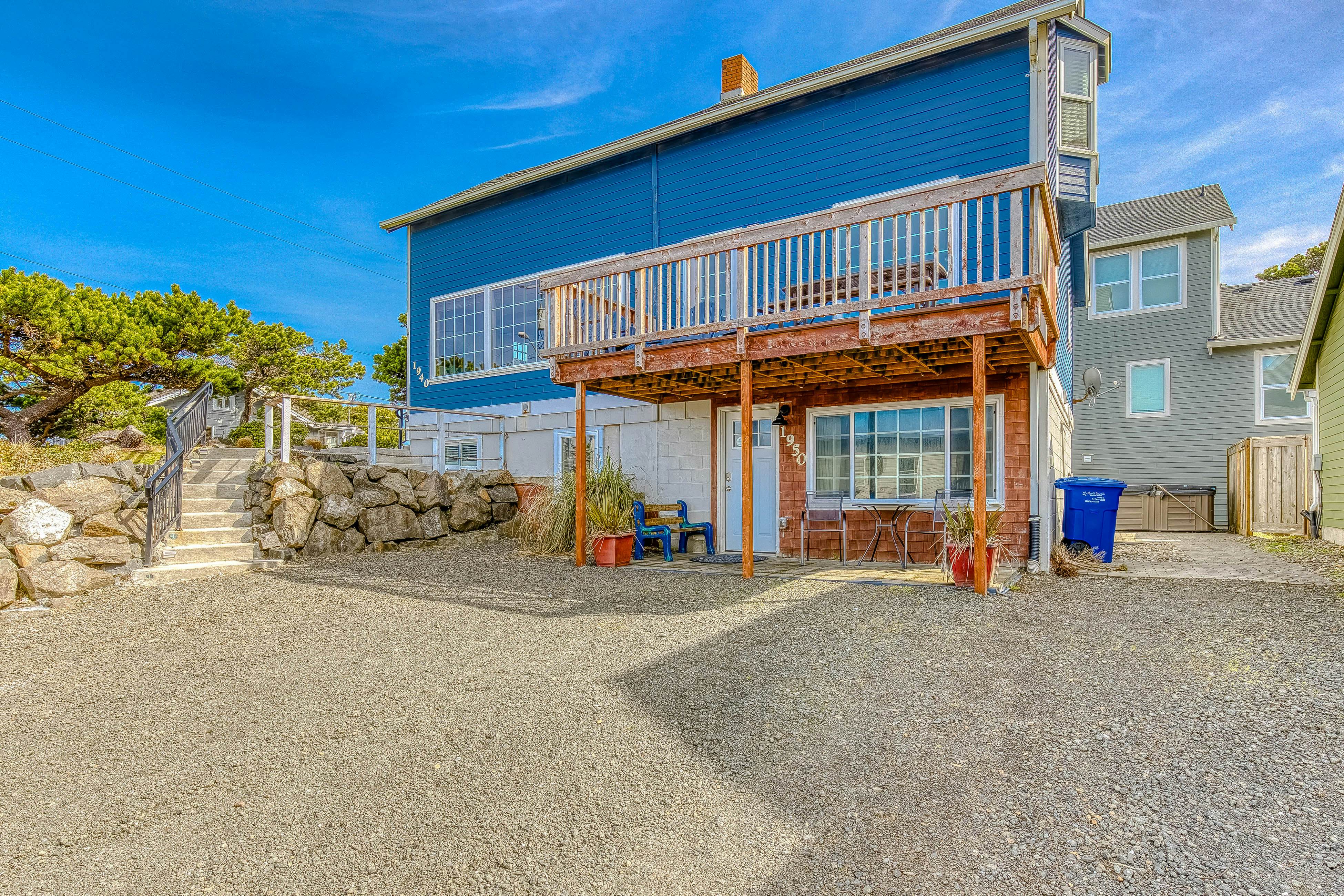 Ocean-view home 1 block from the beach with hot tub, deck, & fireplace
