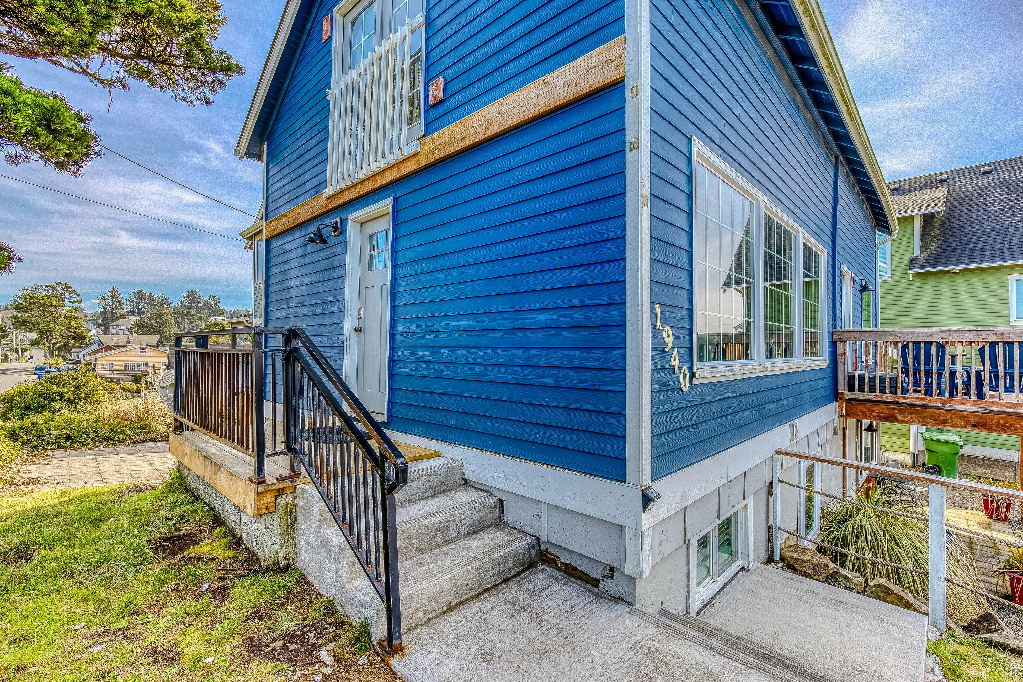 Ocean-view home 1 block from the beach with hot tub, deck, & fireplace