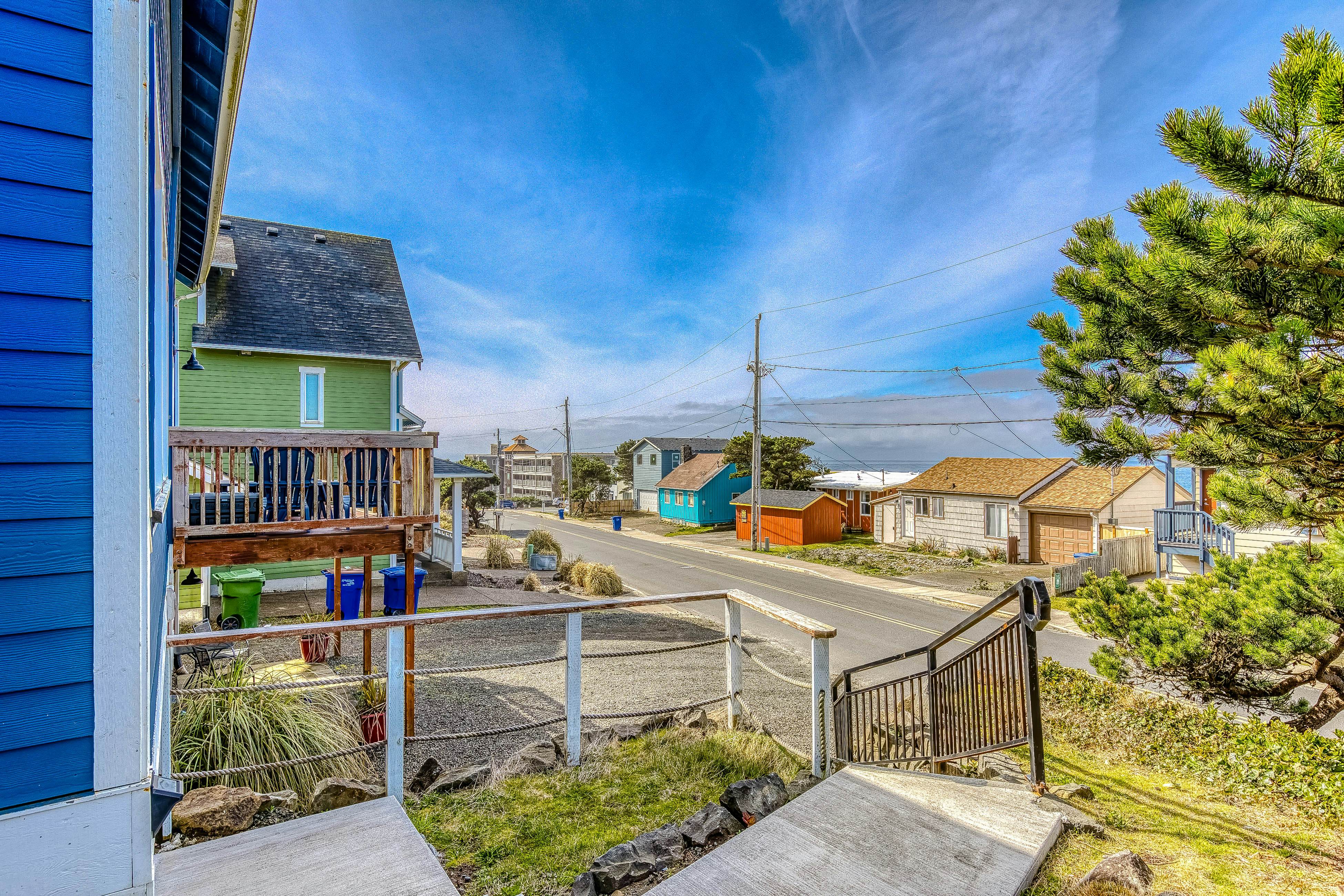 Ocean-view home 1 block from the beach with hot tub, deck, & fireplace