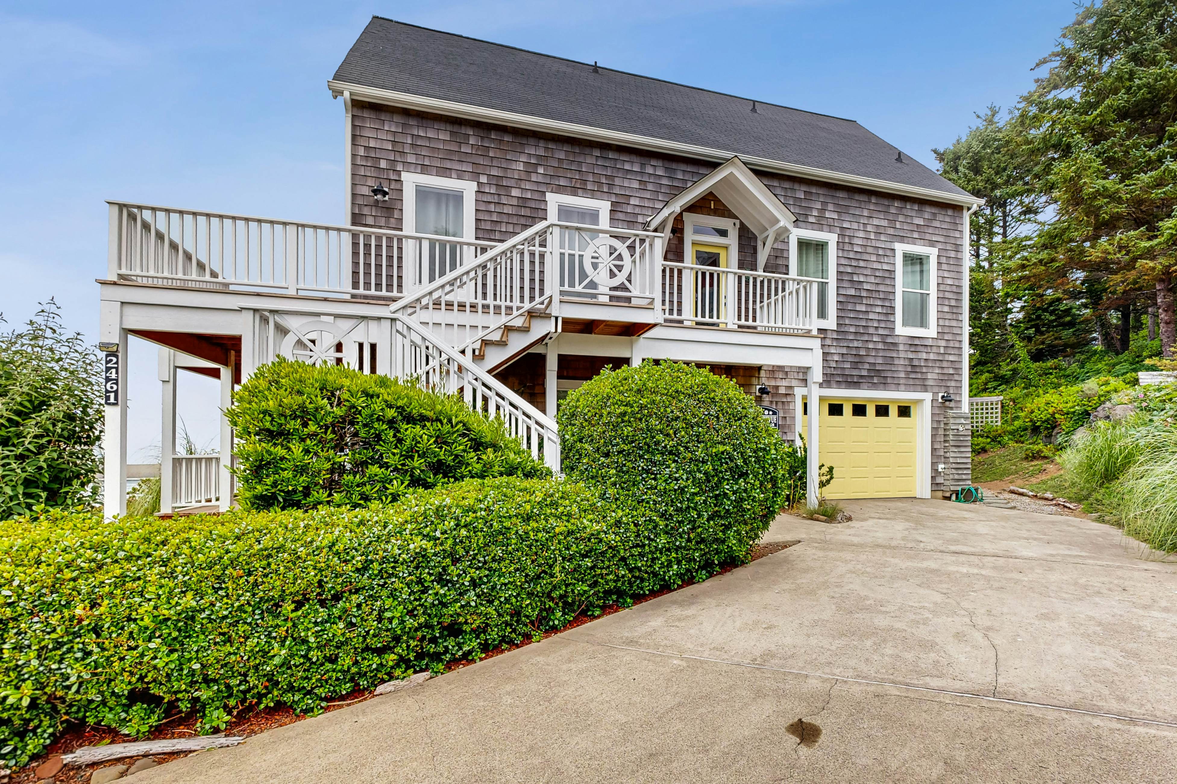 Ocean-view home with hot tub, game room, furnished deck, & fireplaces