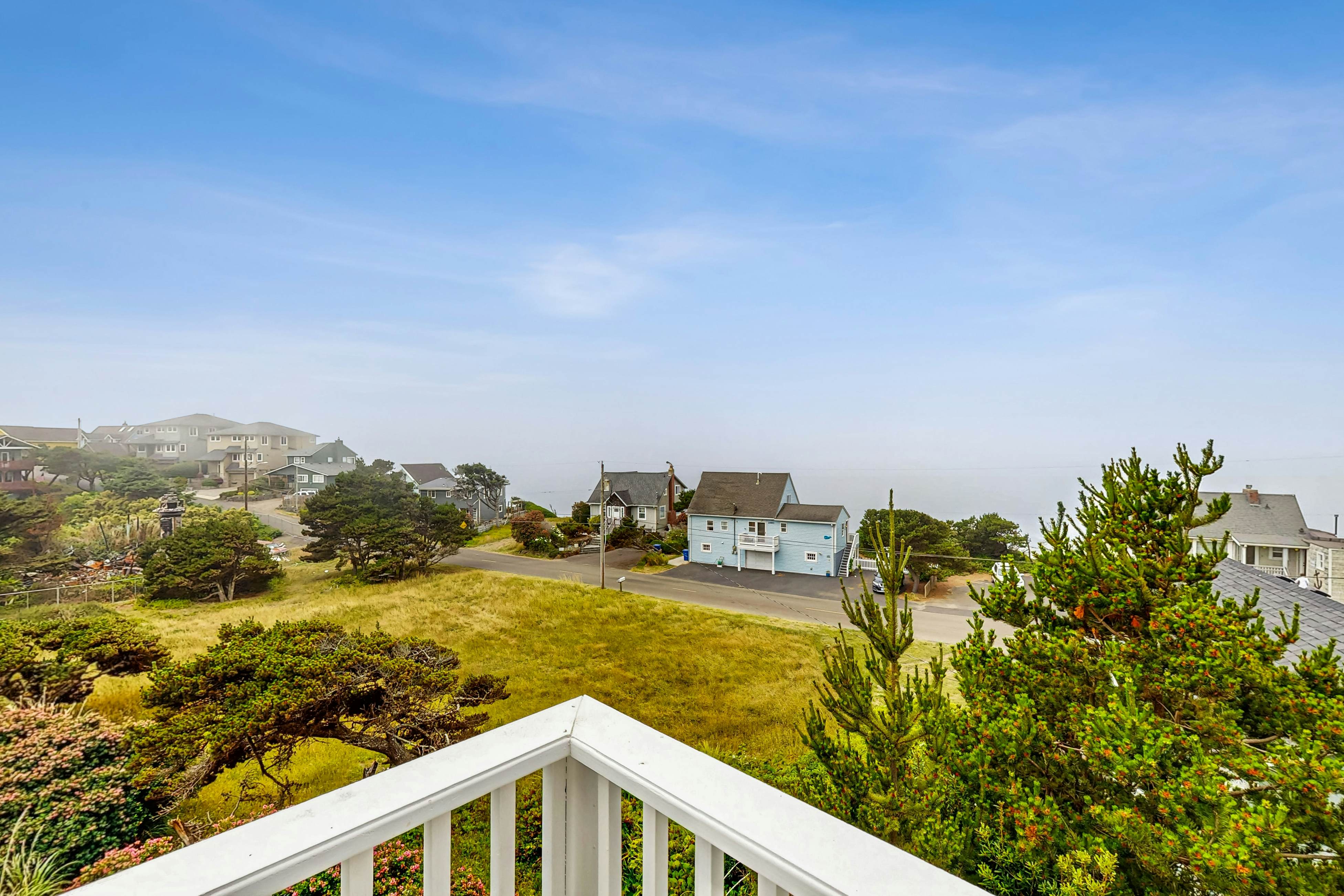 Ocean-view home with hot tub, game room, furnished deck, & fireplaces