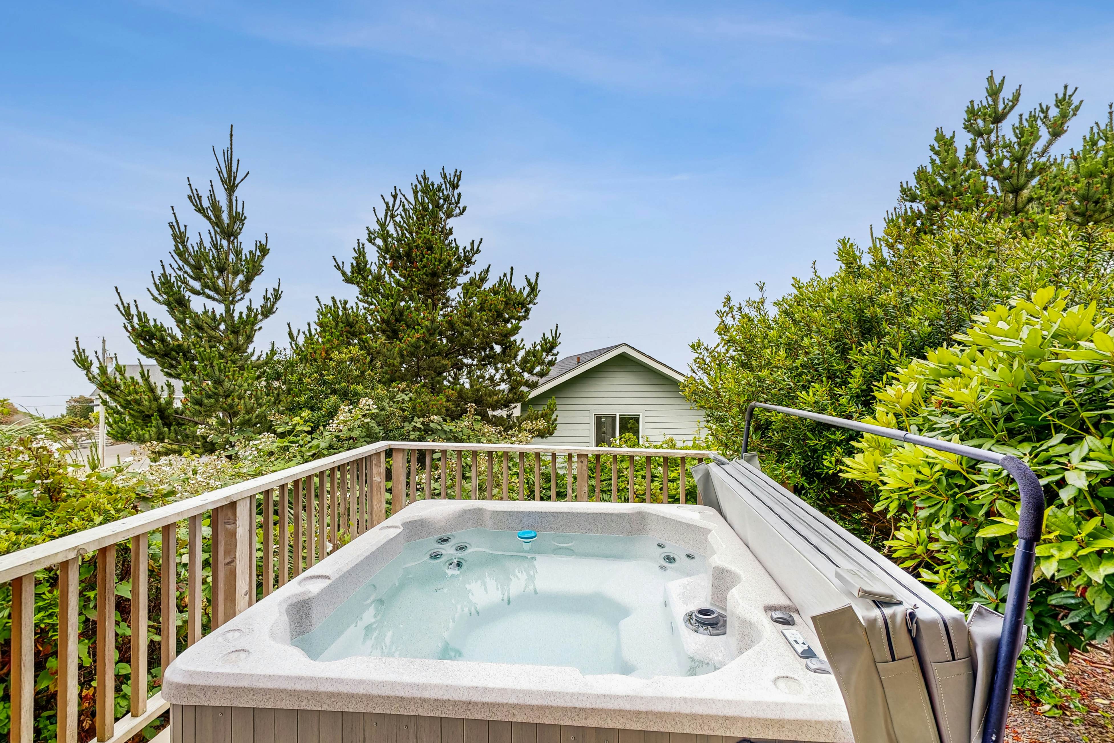 Ocean-view home with hot tub, game room, furnished deck, & fireplaces