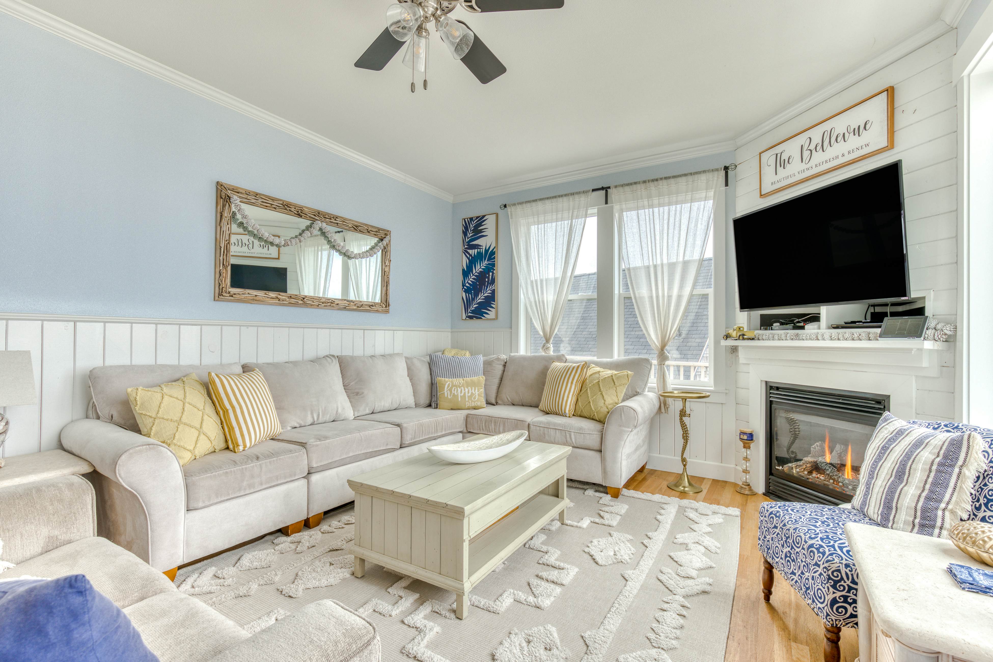 Ocean-view home with hot tub, game room, furnished deck, & fireplaces