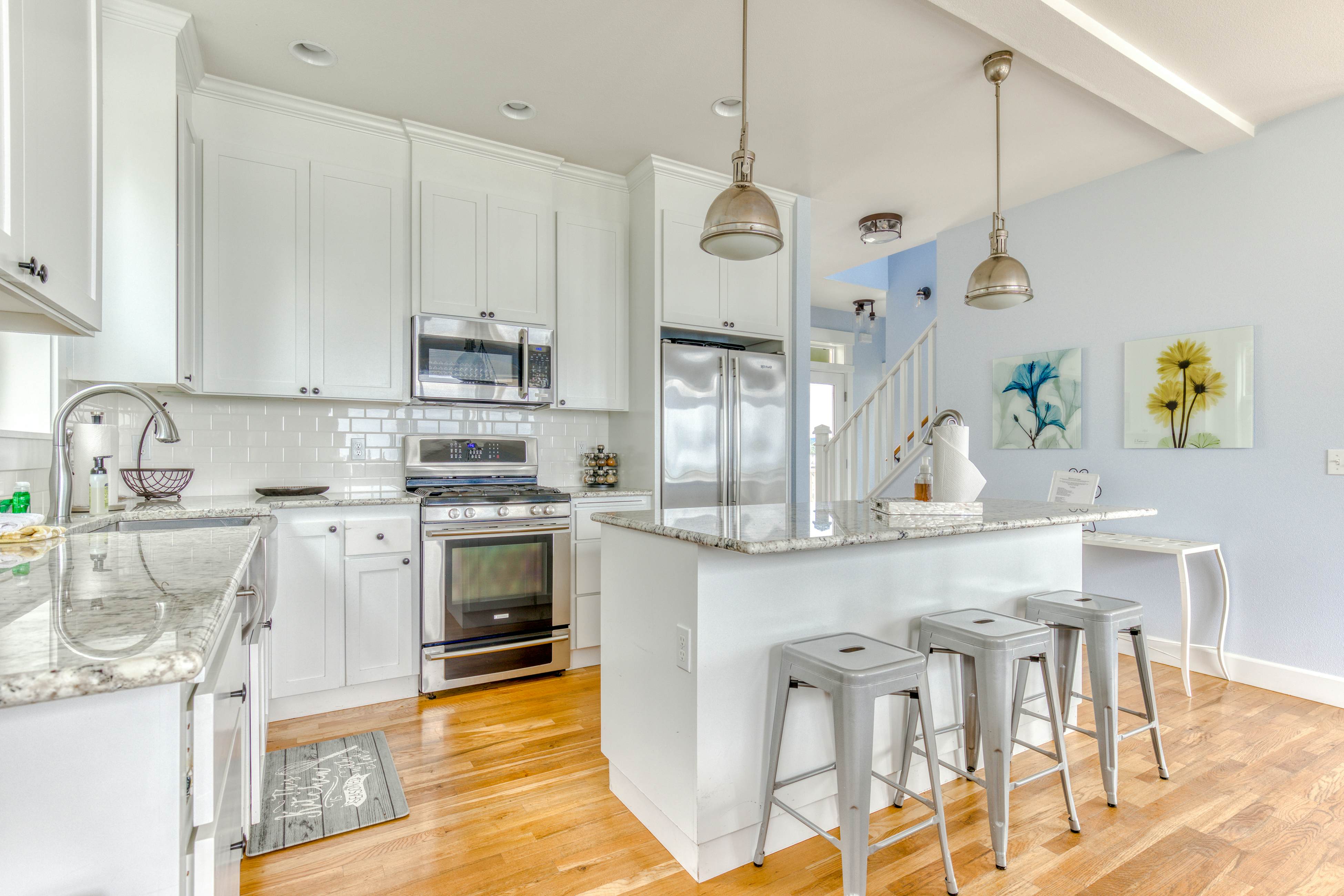 Ocean-view home with hot tub, game room, furnished deck, & fireplaces