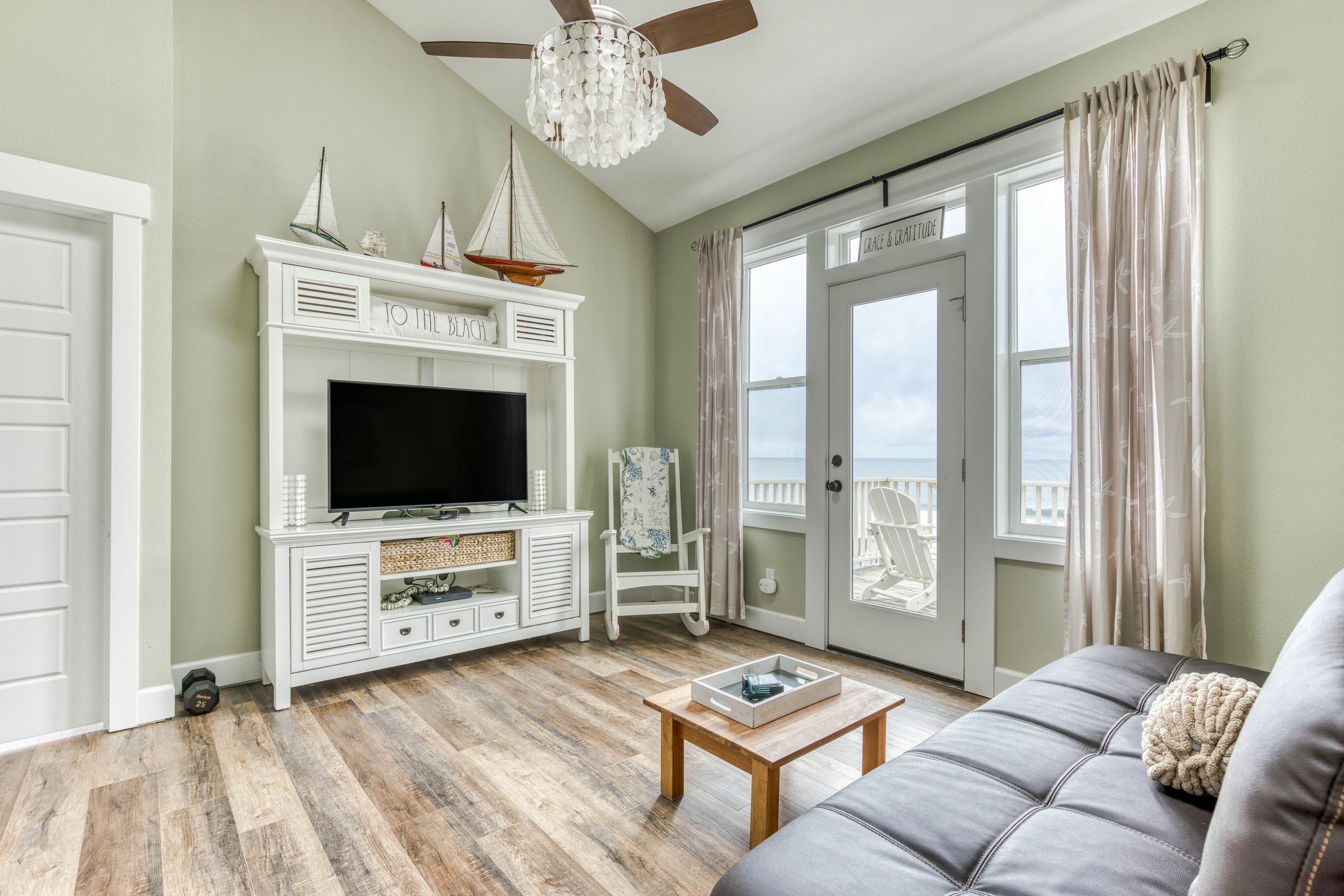 Ocean-view home with hot tub, game room, furnished deck, & fireplaces