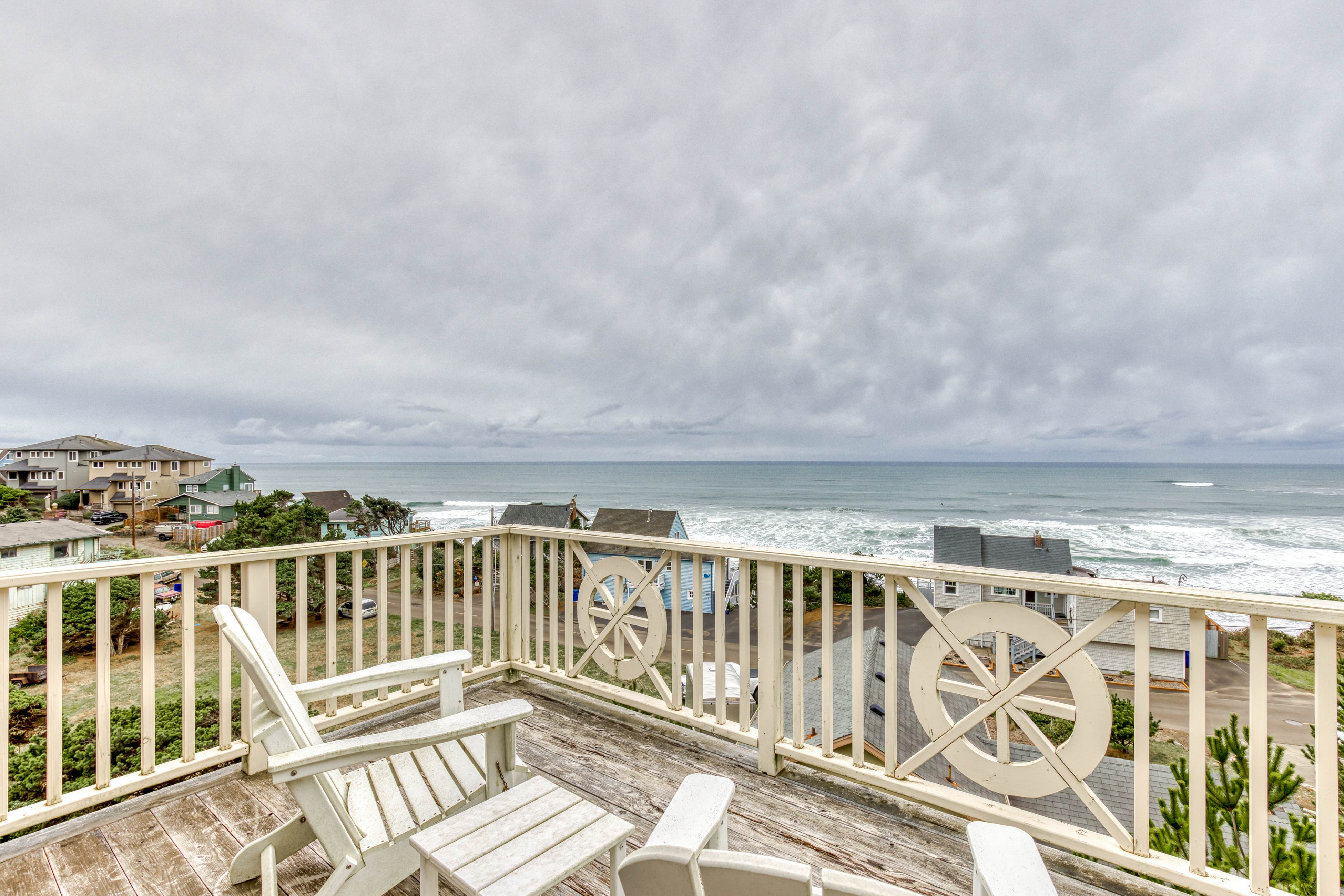 Ocean-view home with hot tub, game room, furnished deck, & fireplaces