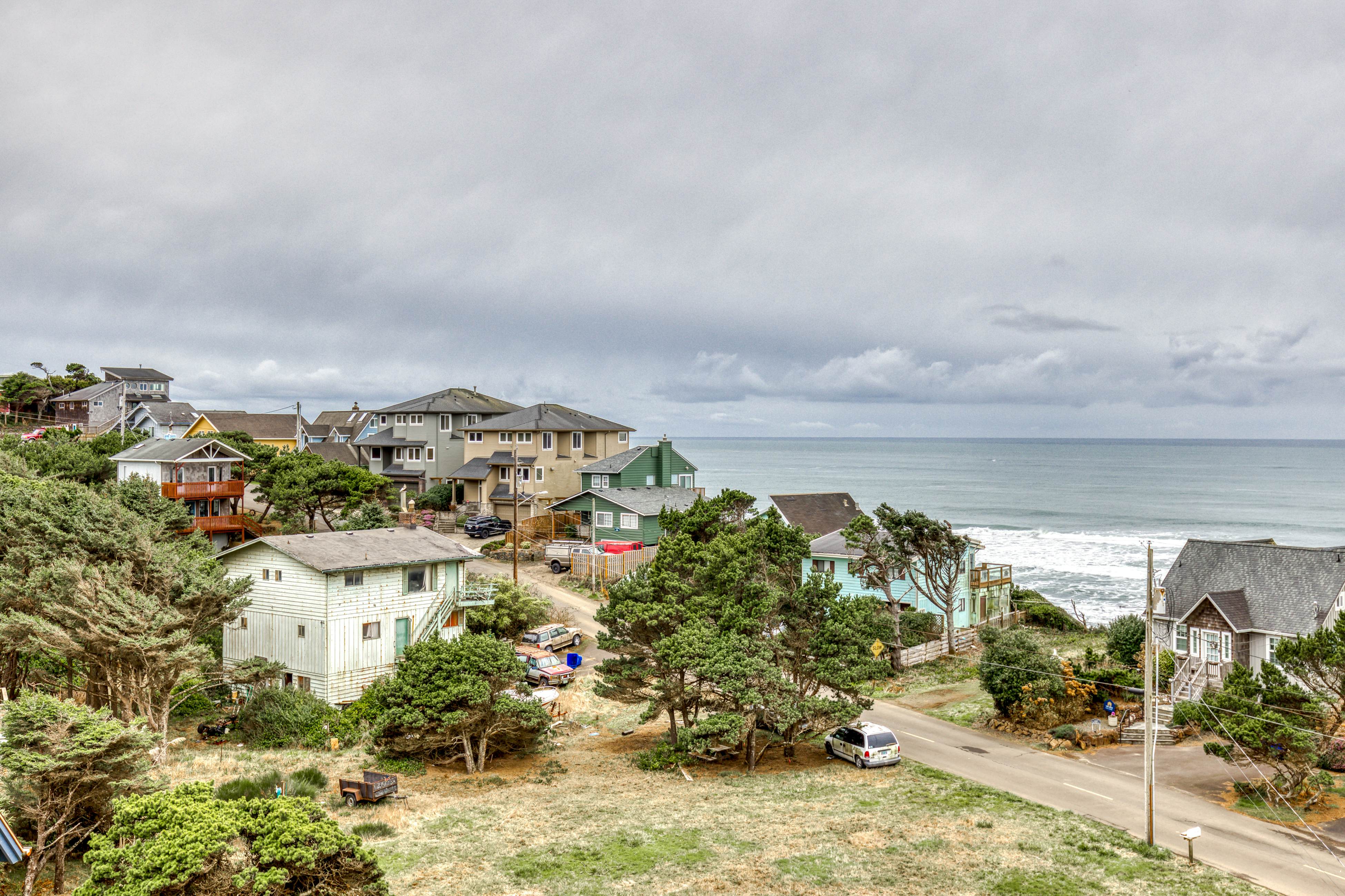 Ocean-view home with hot tub, game room, furnished deck, & fireplaces