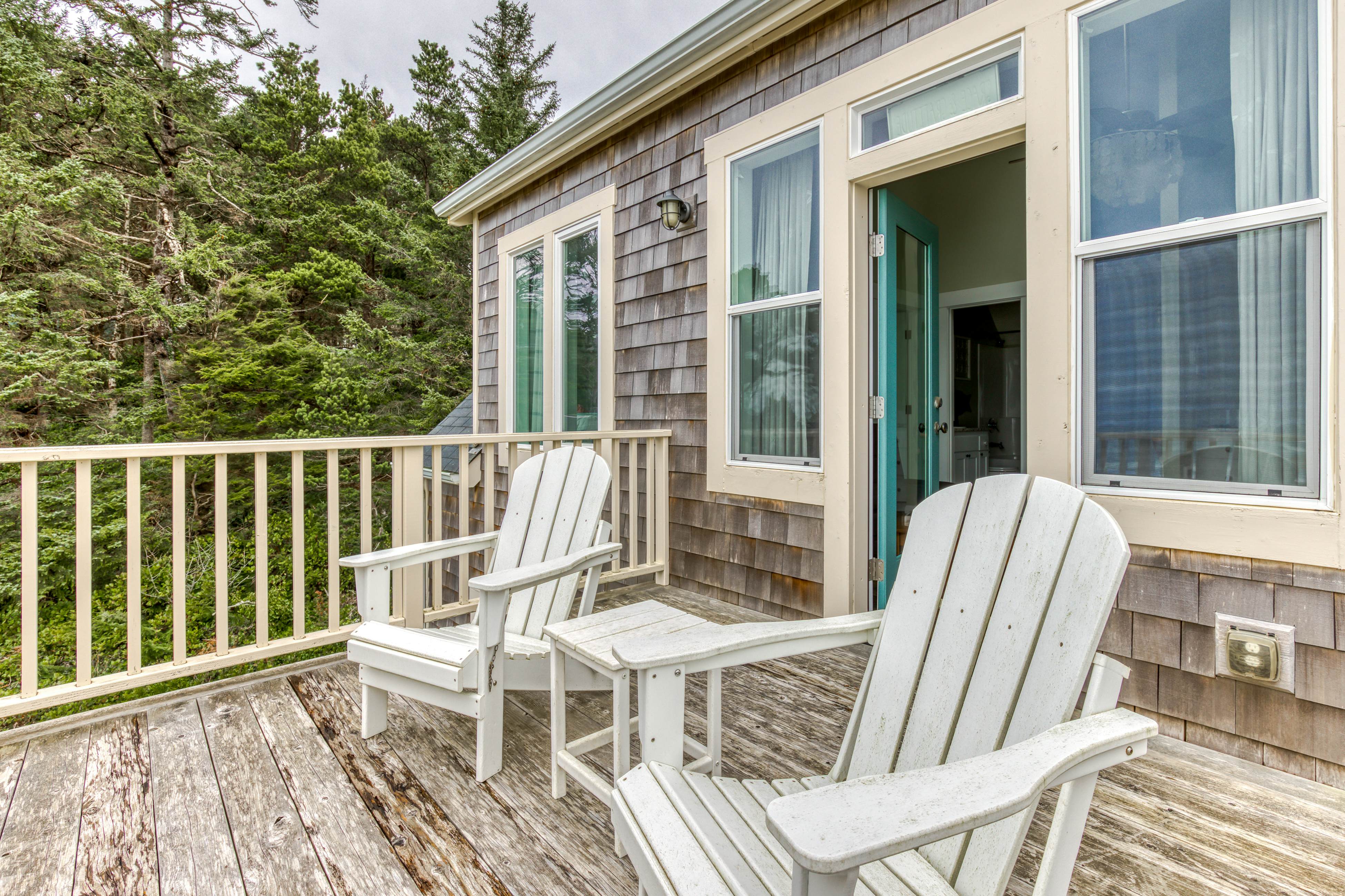 Ocean-view home with hot tub, game room, furnished deck, & fireplaces