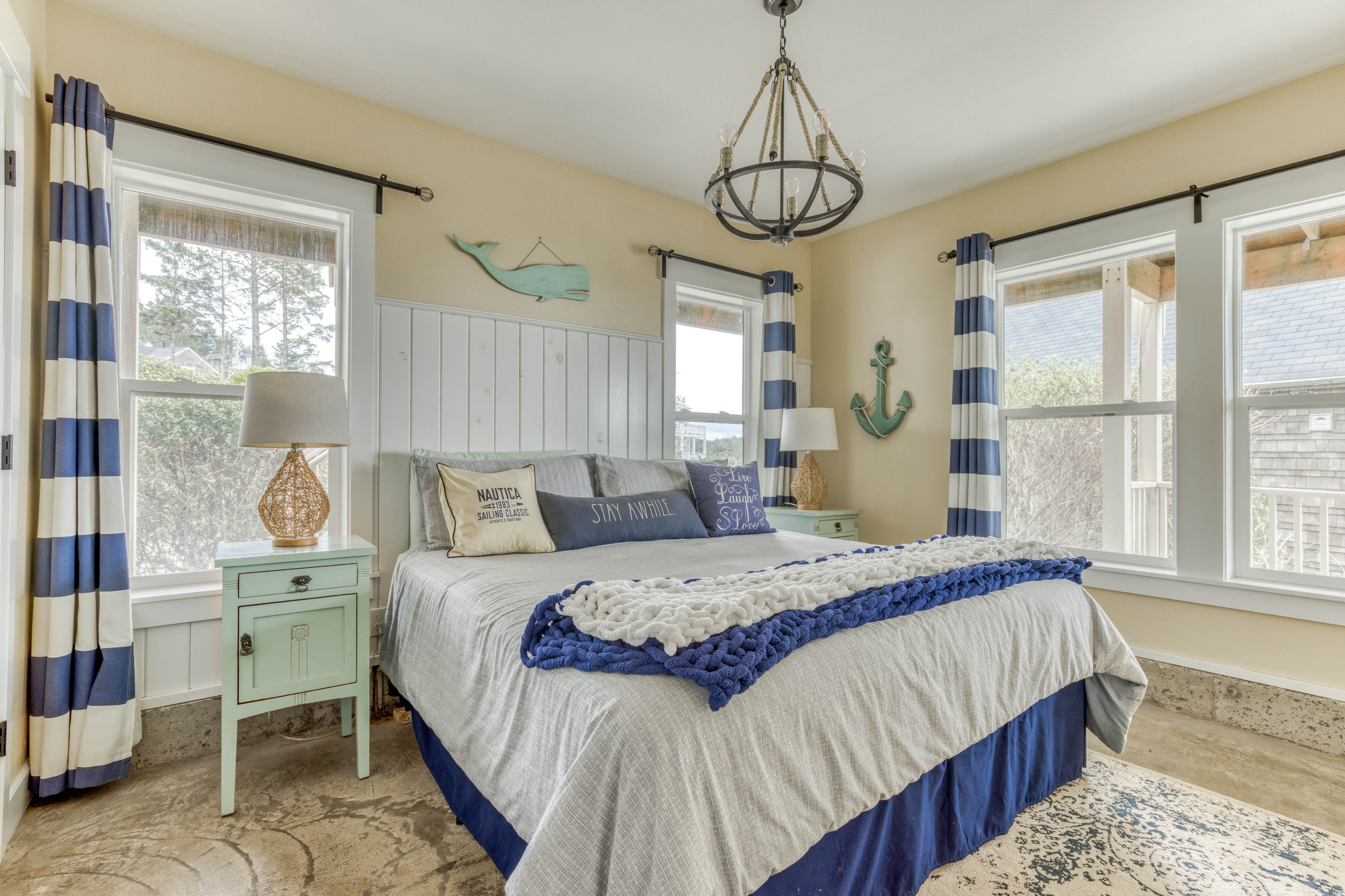 Ocean-view home with hot tub, game room, furnished deck, & fireplaces