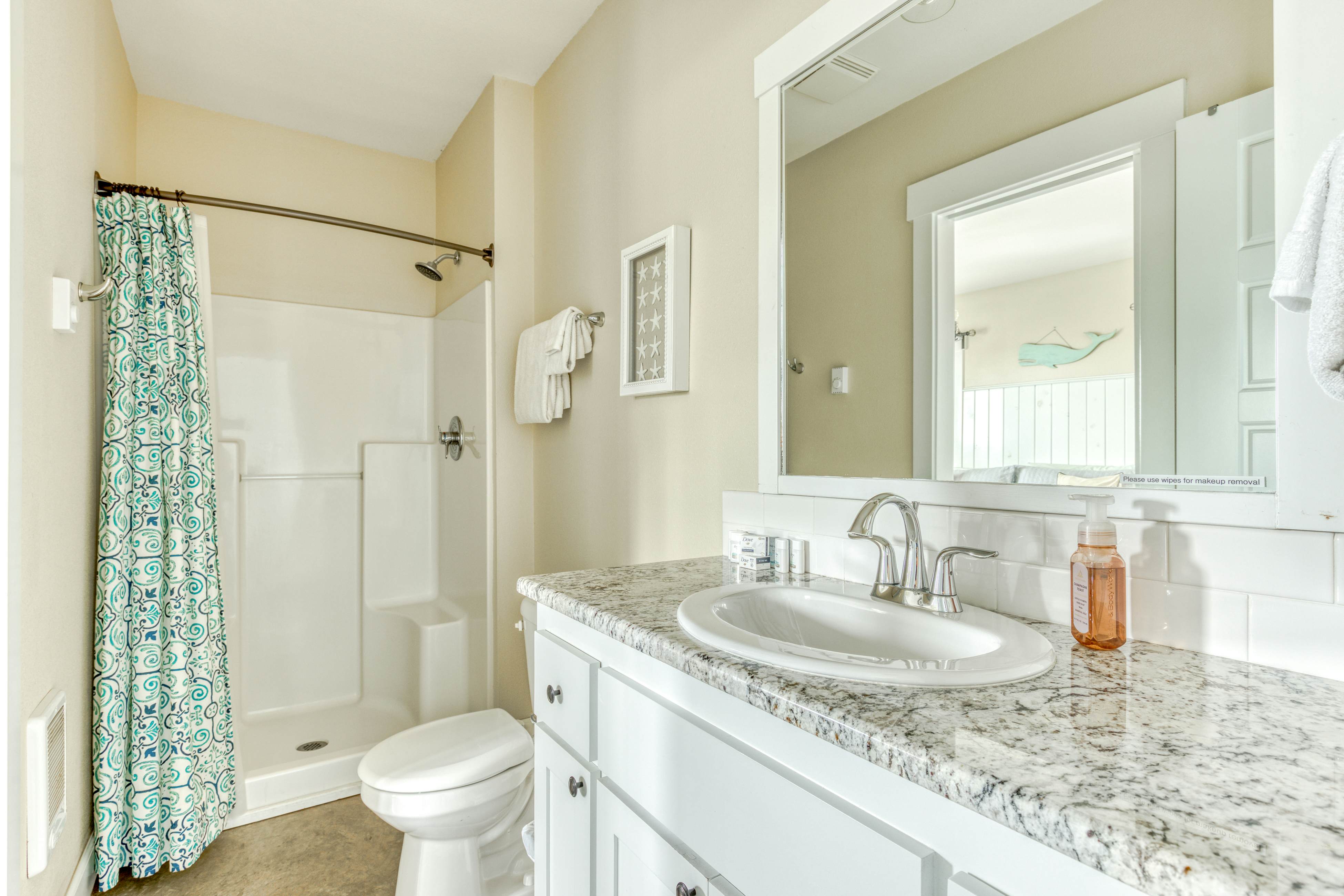 Ocean-view home with hot tub, game room, furnished deck, & fireplaces