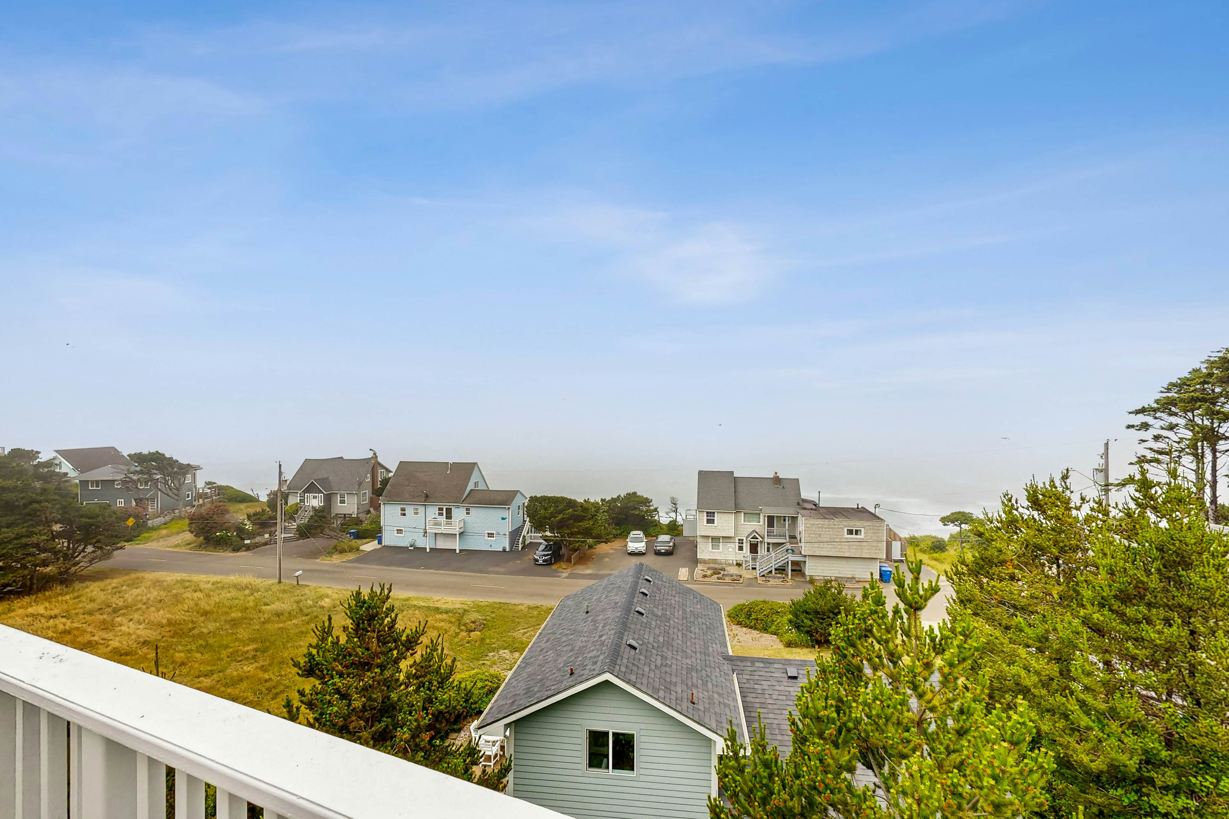 Ocean-view home with hot tub, game room, furnished deck, & fireplaces