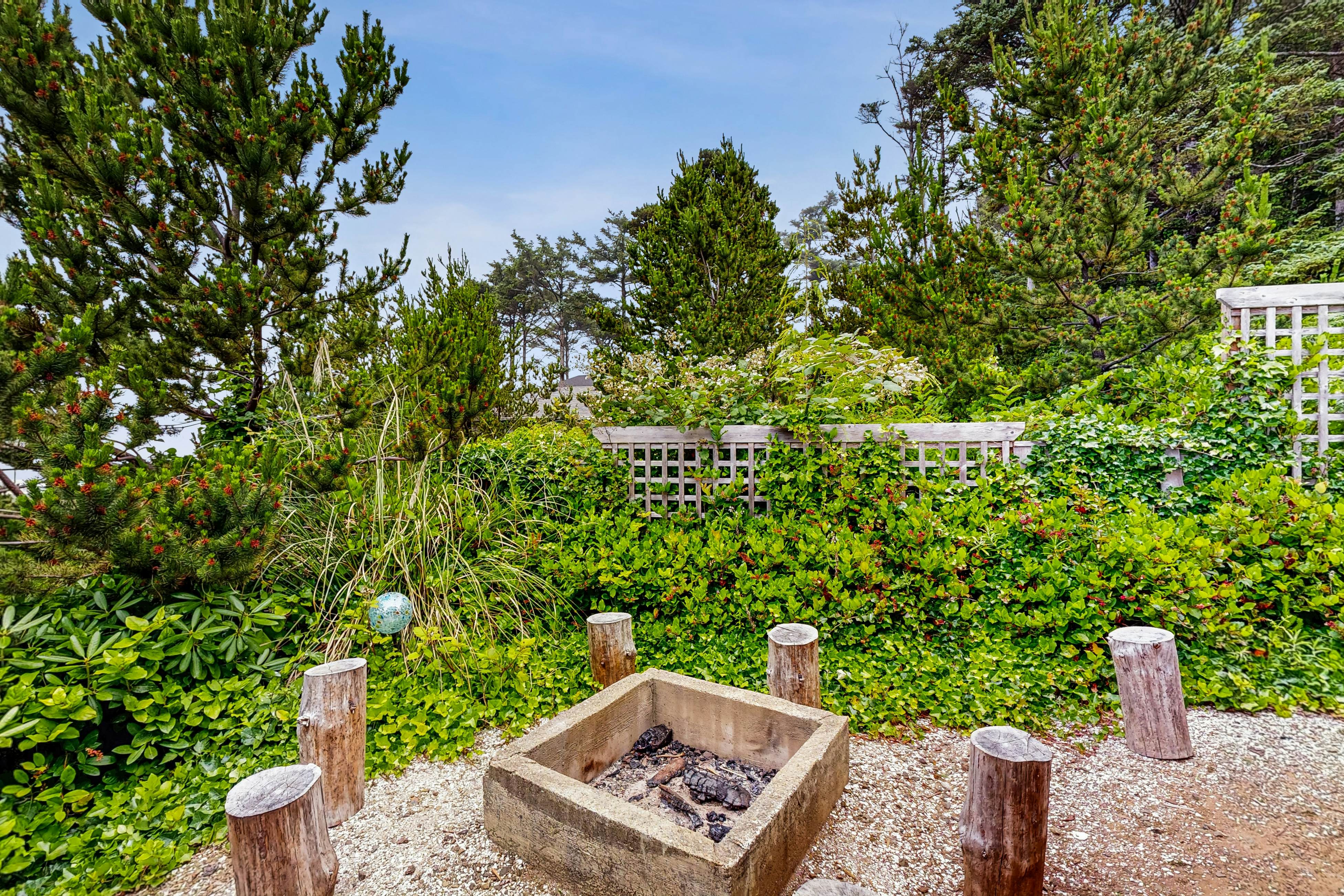 Ocean-view home with hot tub, game room, furnished deck, & fireplaces