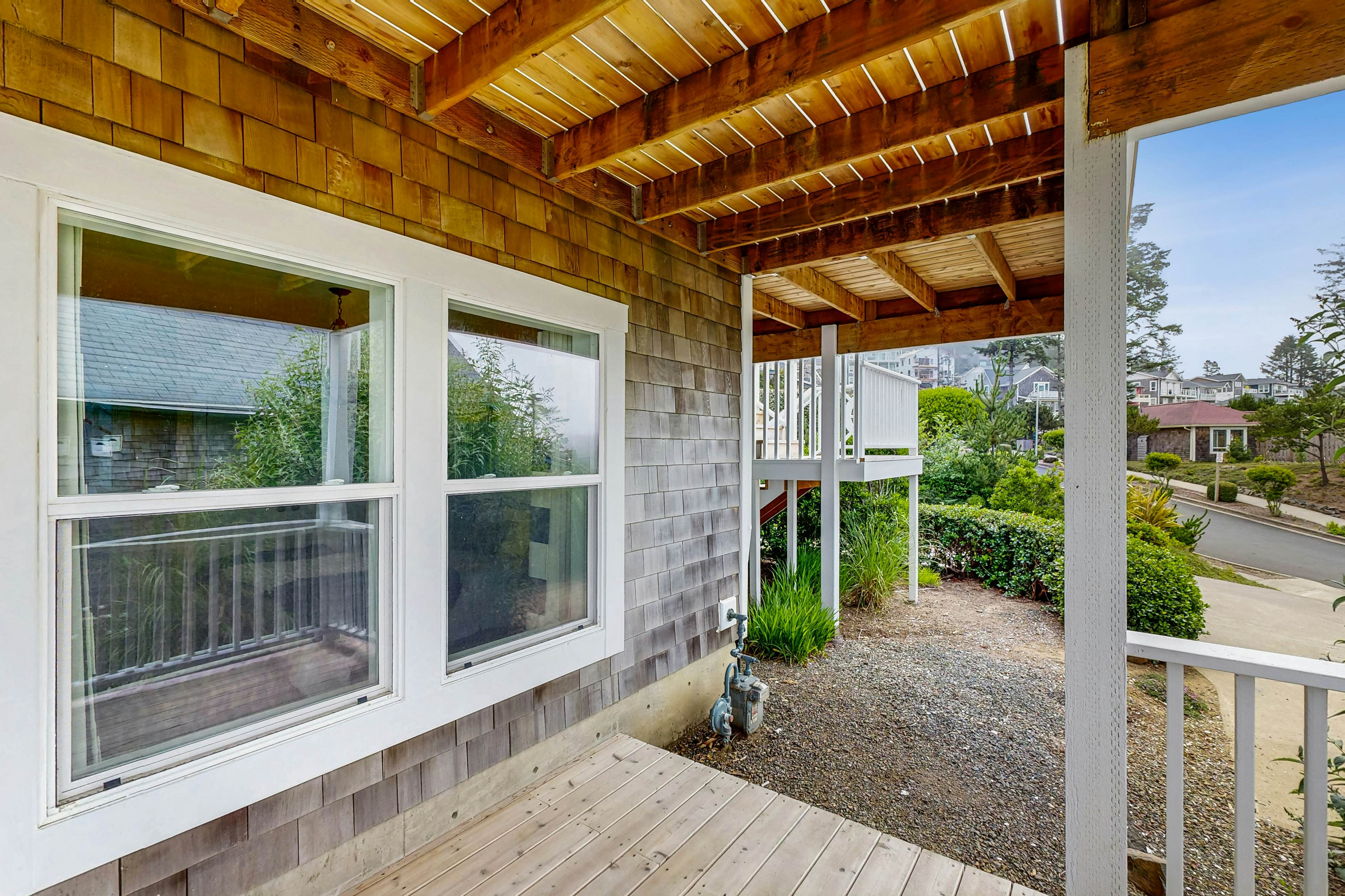 Ocean-view home with hot tub, game room, furnished deck, & fireplaces