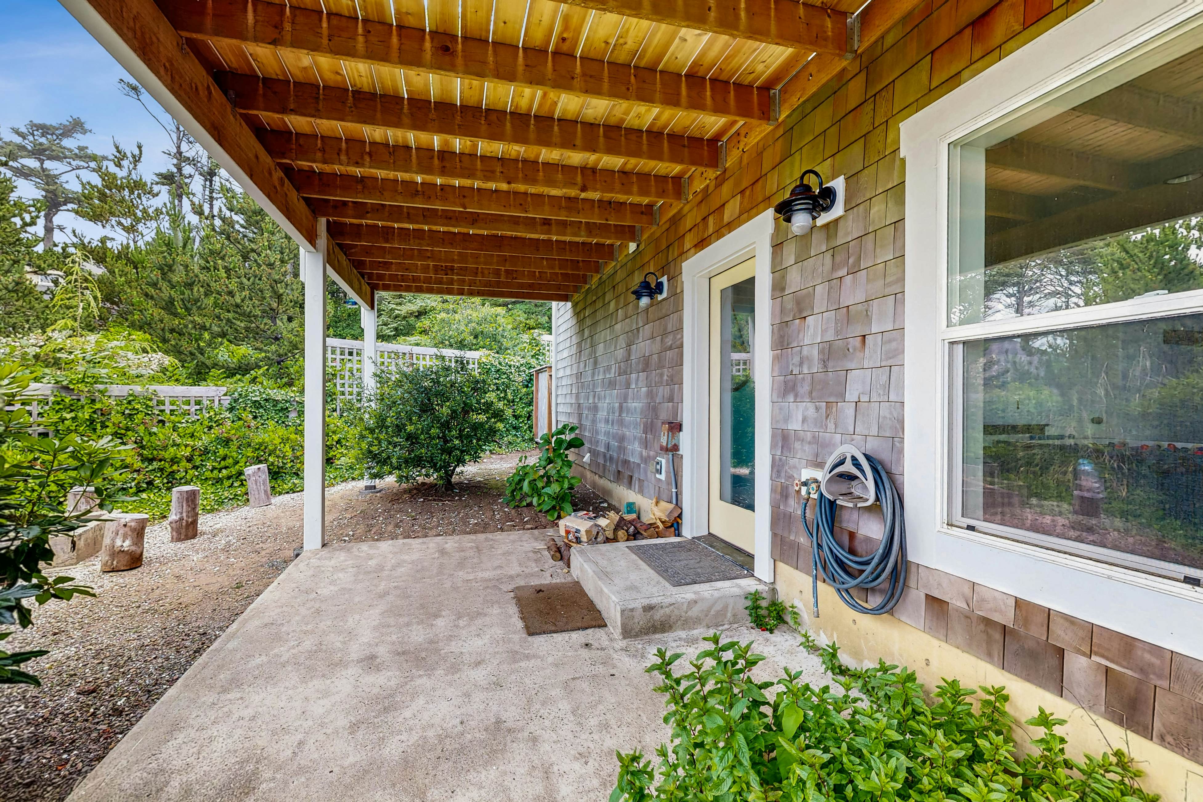 Ocean-view home with hot tub, game room, furnished deck, & fireplaces