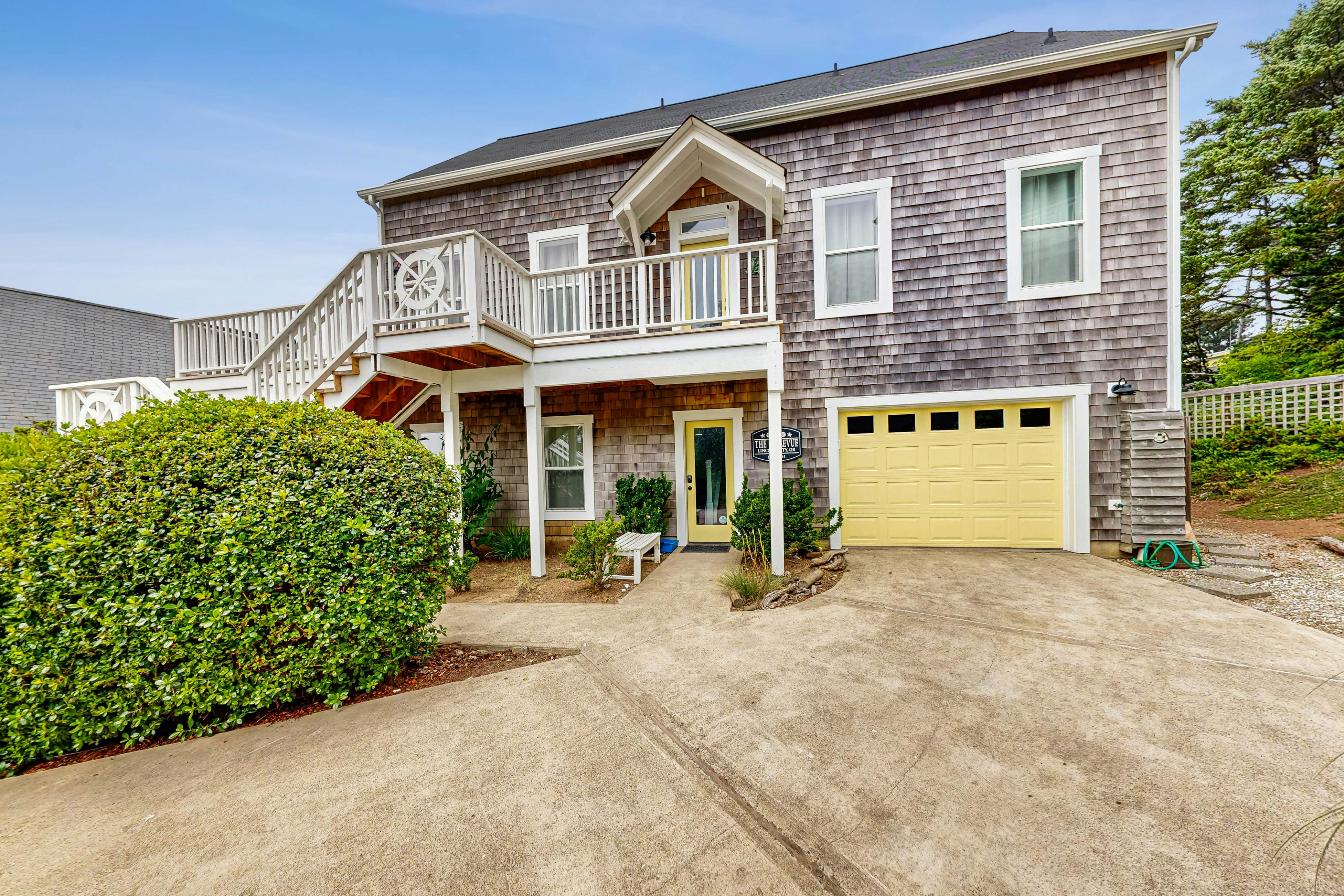 Ocean-view home with hot tub, game room, furnished deck, & fireplaces