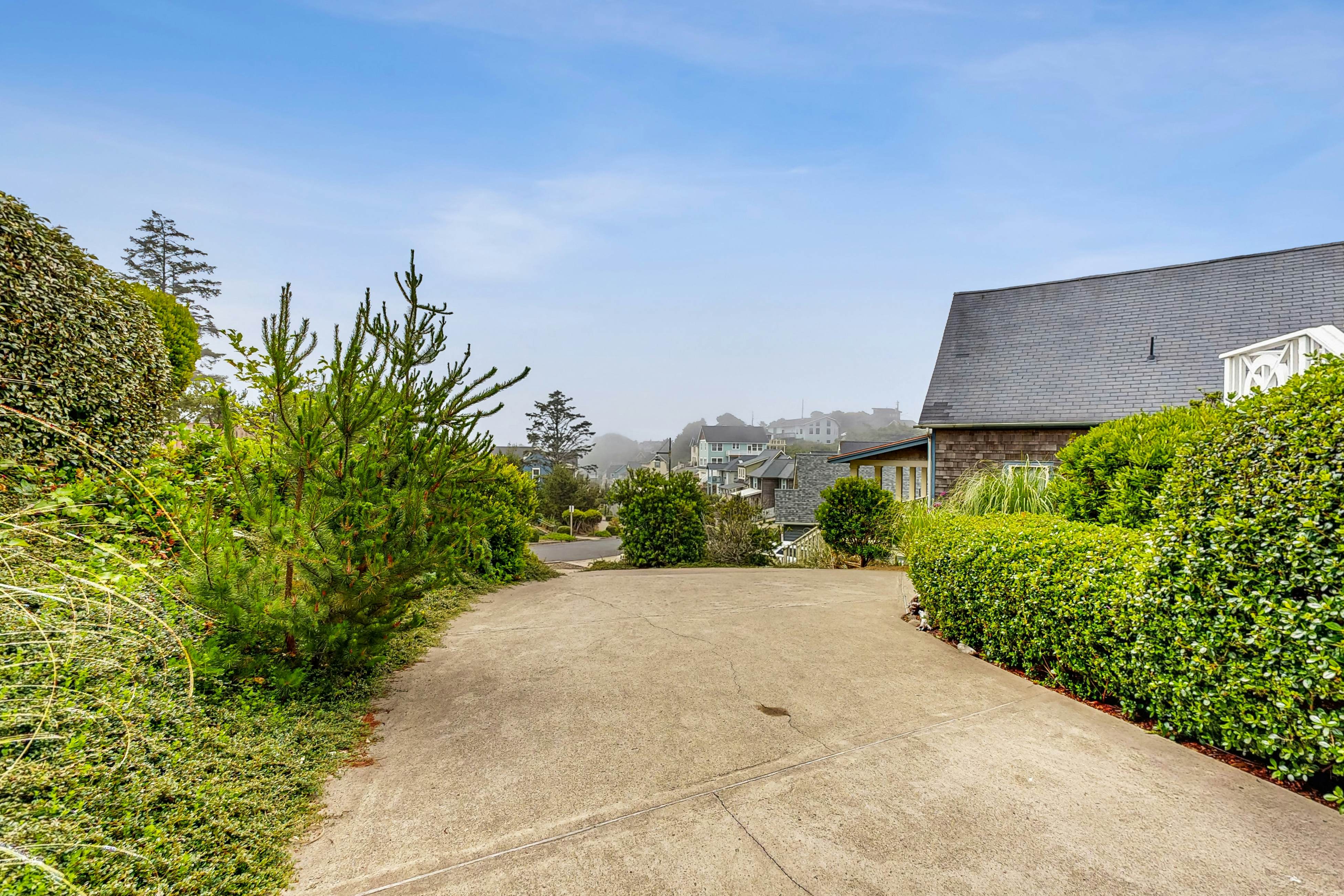 Ocean-view home with hot tub, game room, furnished deck, & fireplaces