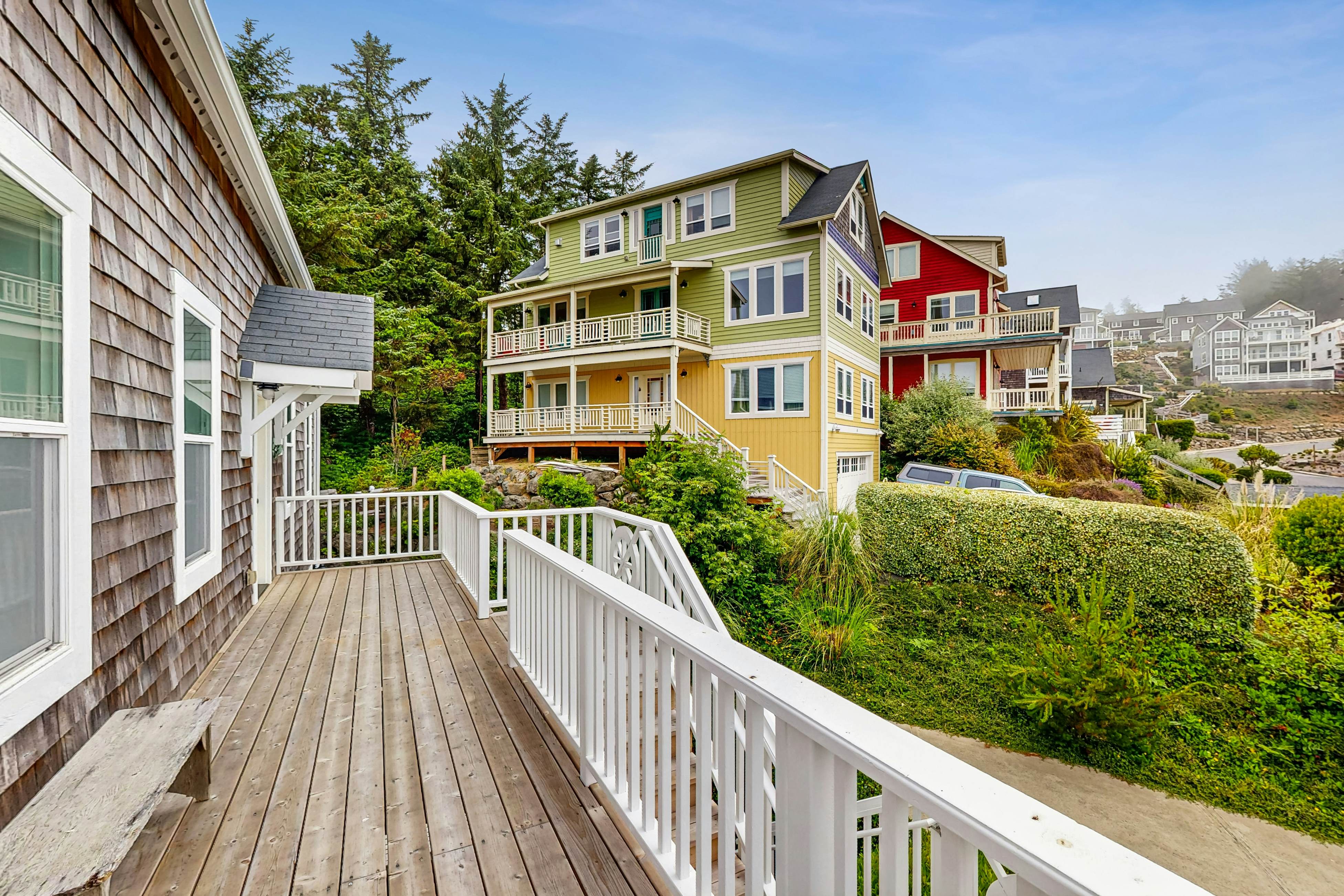 Ocean-view home with hot tub, game room, furnished deck, & fireplaces