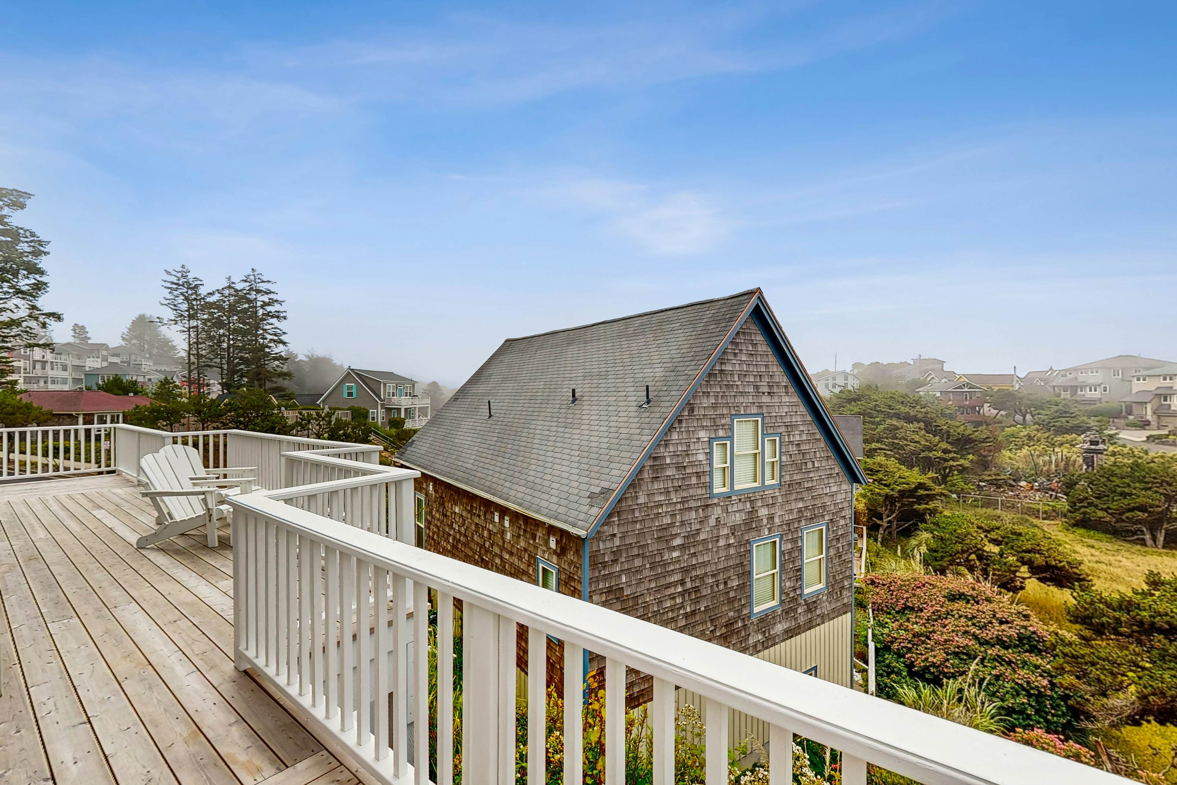 Ocean-view home with hot tub, game room, furnished deck, & fireplaces