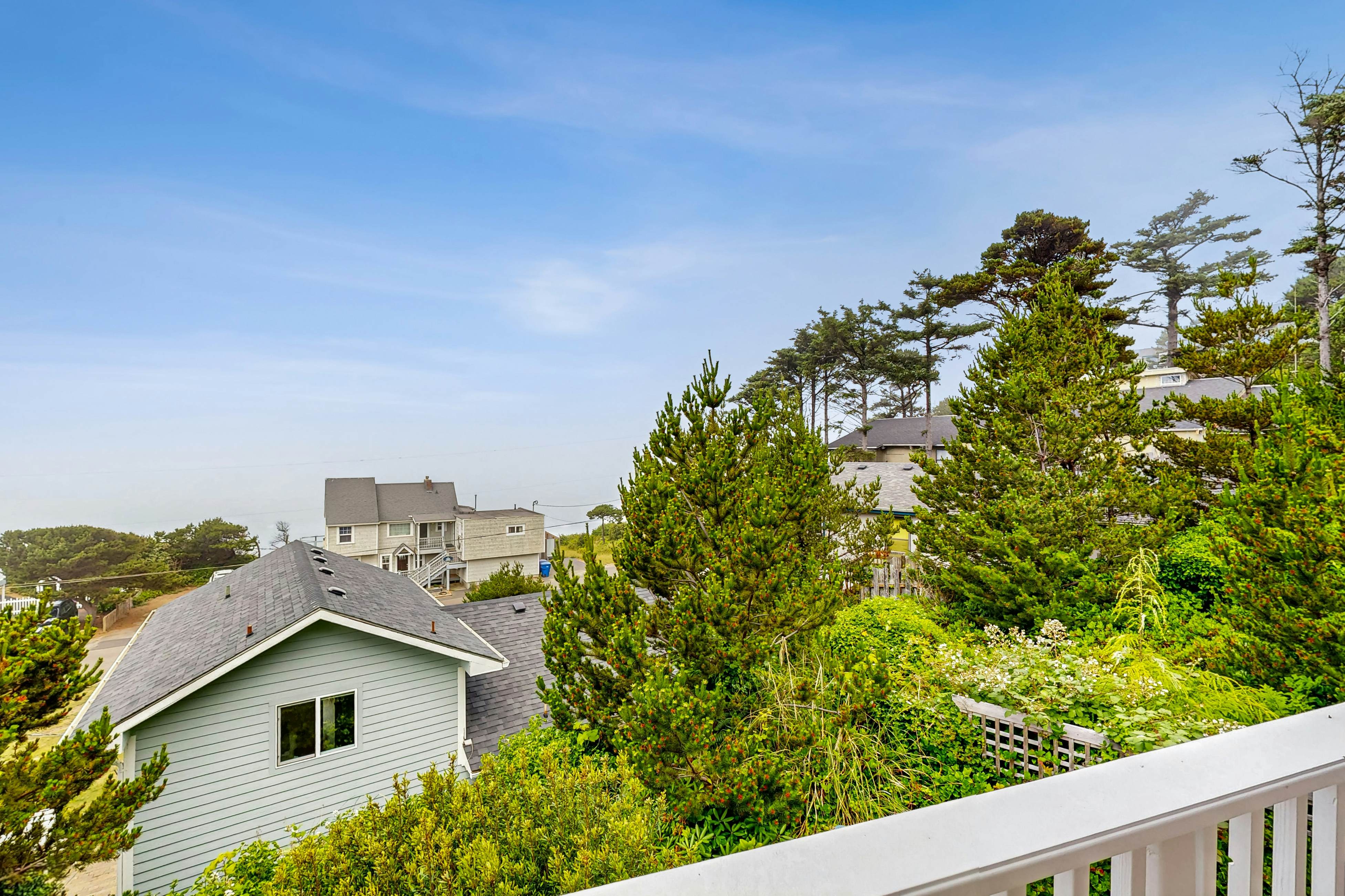 Ocean-view home with hot tub, game room, furnished deck, & fireplaces