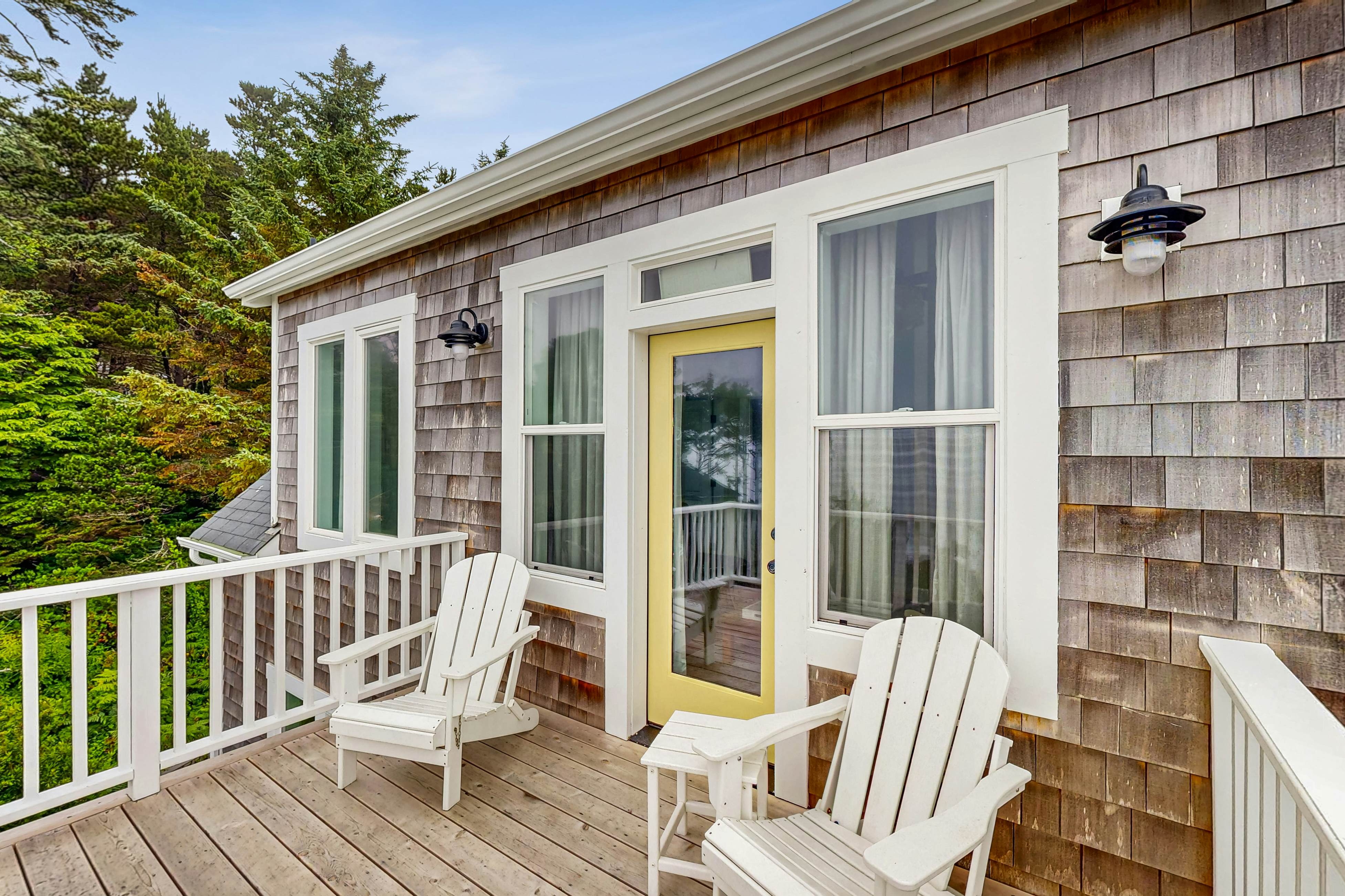 Ocean-view home with hot tub, game room, furnished deck, & fireplaces