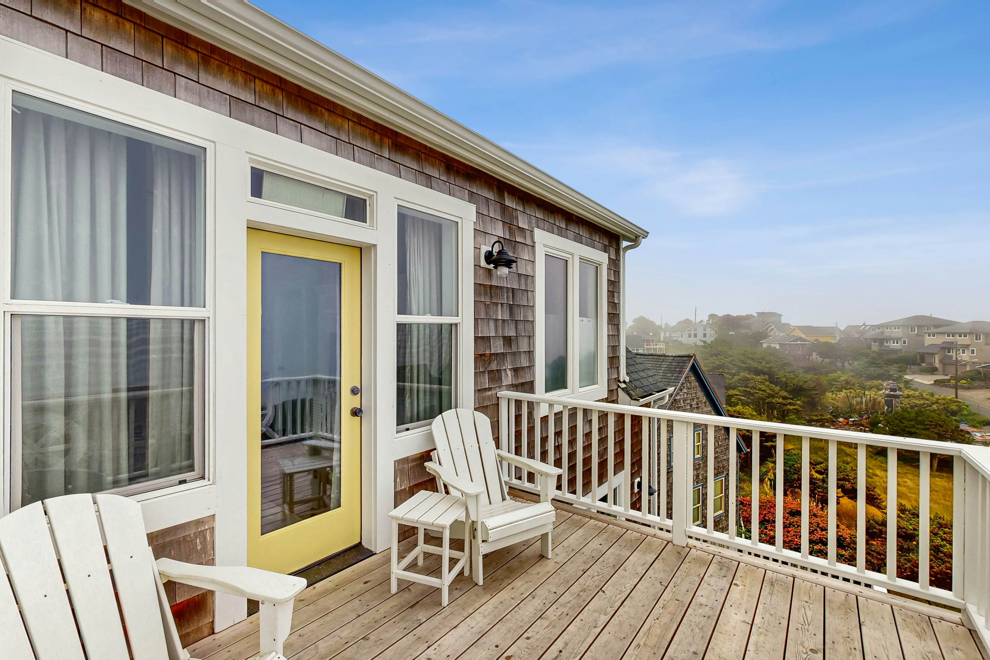 Ocean-view home with hot tub, game room, furnished deck, & fireplaces